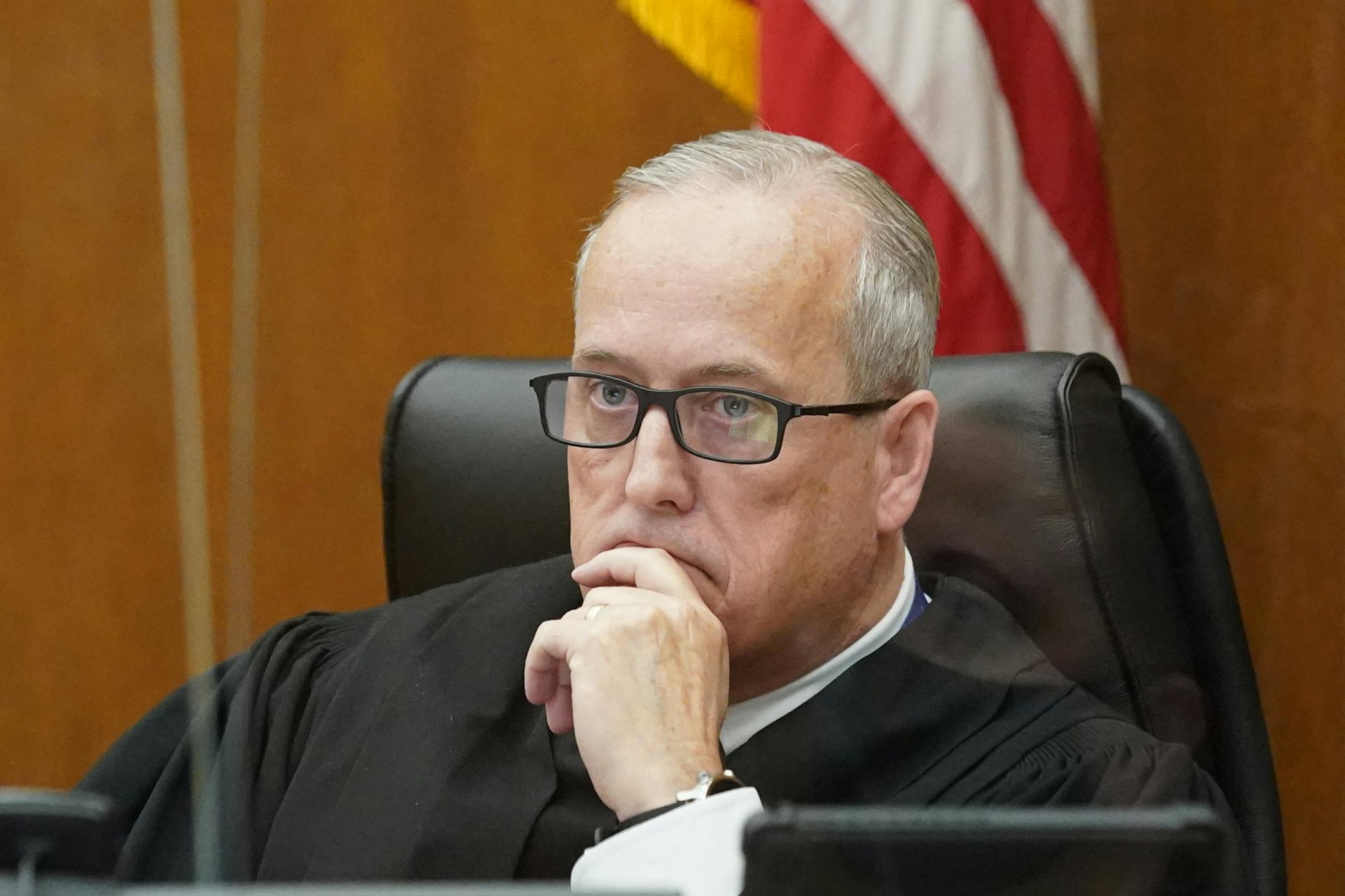 Judge Peter Cahill listened as prosecutor Paige Starkey spoke before sentencing. Former Hennepin County probation officer, Elsa Segura, is sentenced, Tuesday, Nov. 9, 2021, in Hennepin County Court, Minneapolis, Minn., for luring Realtor, Monique Baugh, to a fake home showing where she was kidnapped and murdered.