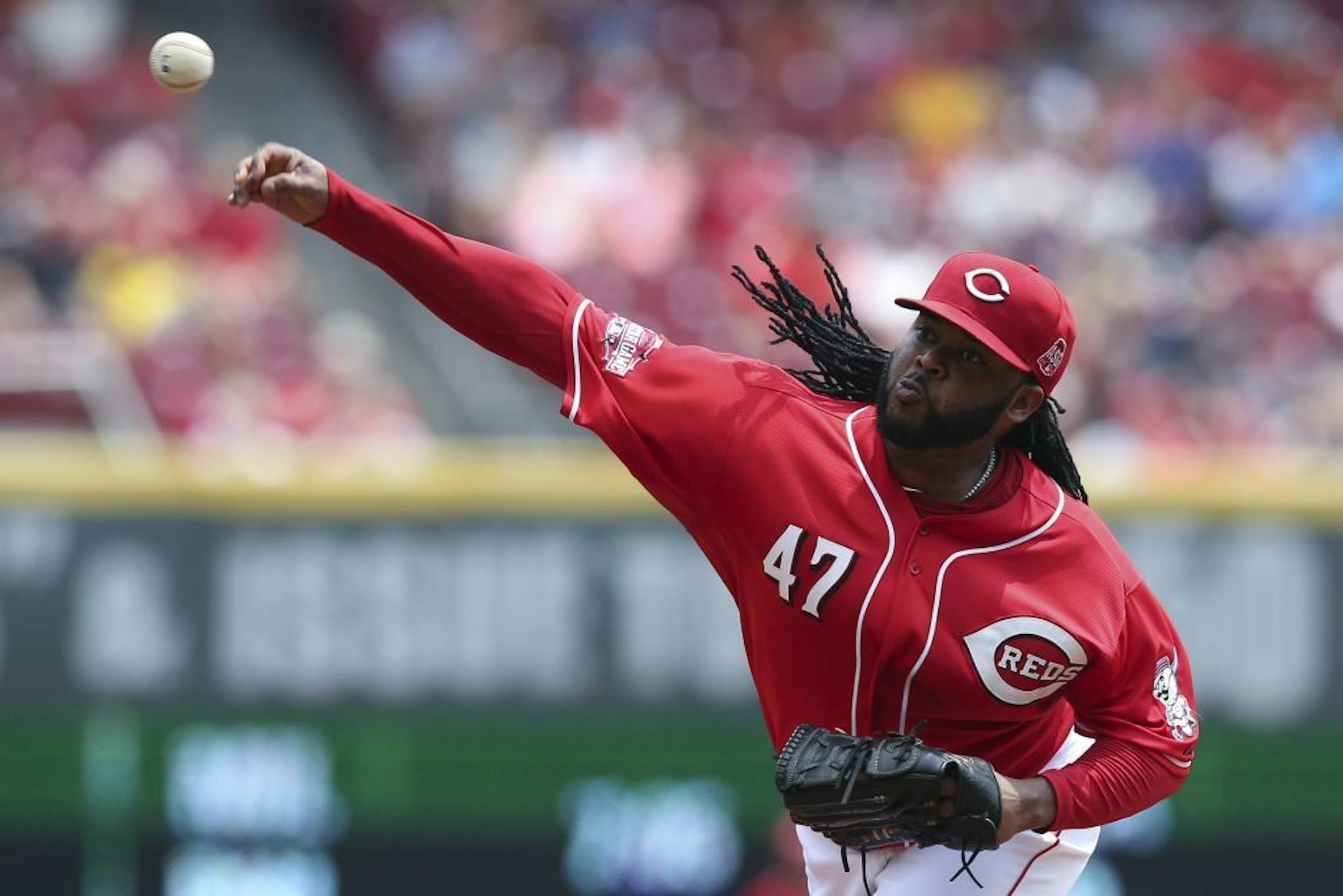 Cincinnati Reds starting pitcher Johnny Cueto throws in the second inning of a baseball game against the Minnesota Twins, Wednesday, July 1, 2015, in Cincinnati.