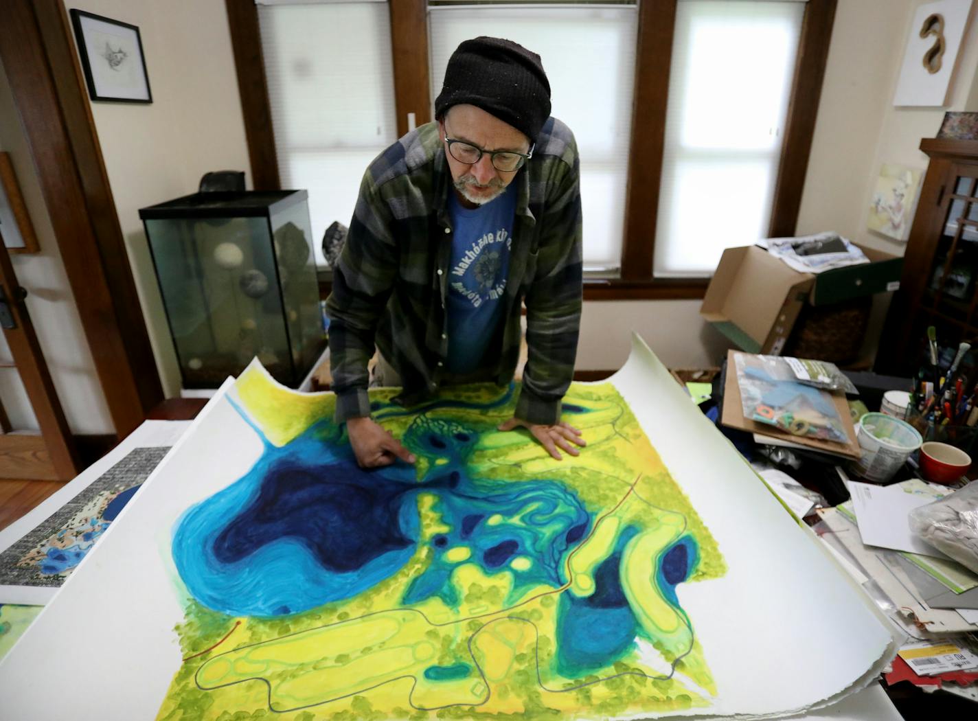 Sean Connaughty, who lives near Lake Hiawatha and who some consider Hiawatha's caretaker, with a painting he did of Lake Hiawatha and the surrounding area and how it might look in the future with the nearby golf course going from 18 to 9 holes and seen Tuesday, Aug. 27, 2019, in Minneapolis, MN.] DAVID JOLES &#x2022; david.joles@startribune.com Sean Connaughty, is also an art professor at the University of Minnesota, picks up trash in and around Lake Hiawatha. Some 6,500 pounds of it over the la