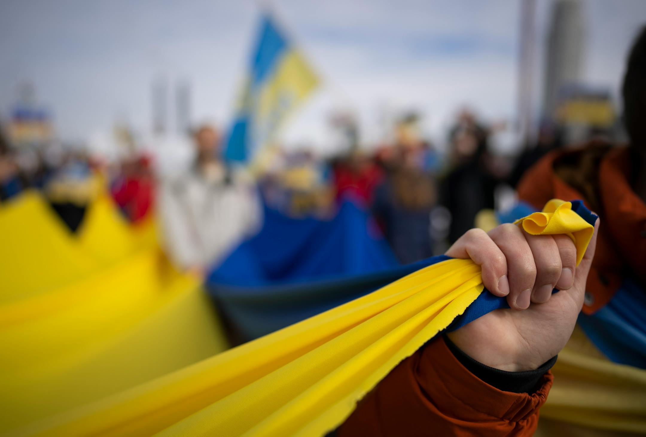 Ukraine supporters met with a delegation of Belarusians on the Stone Arch Bridge who voiced support for Ukraine Sunday afternoon, February 27, 2022 in Minneapolis, Minn. Hundreds of supporters of the people of Ukraine met a few dozen supporters of the Belarusian people midway across the Stone Arch Bridge in Minneapolis before continuing on a march together across the Hennepin Ave. bridge to Northeast Minneapolis where the march first began. ] JEFF WHEELER • Jeff.Wheeler@startribune.com