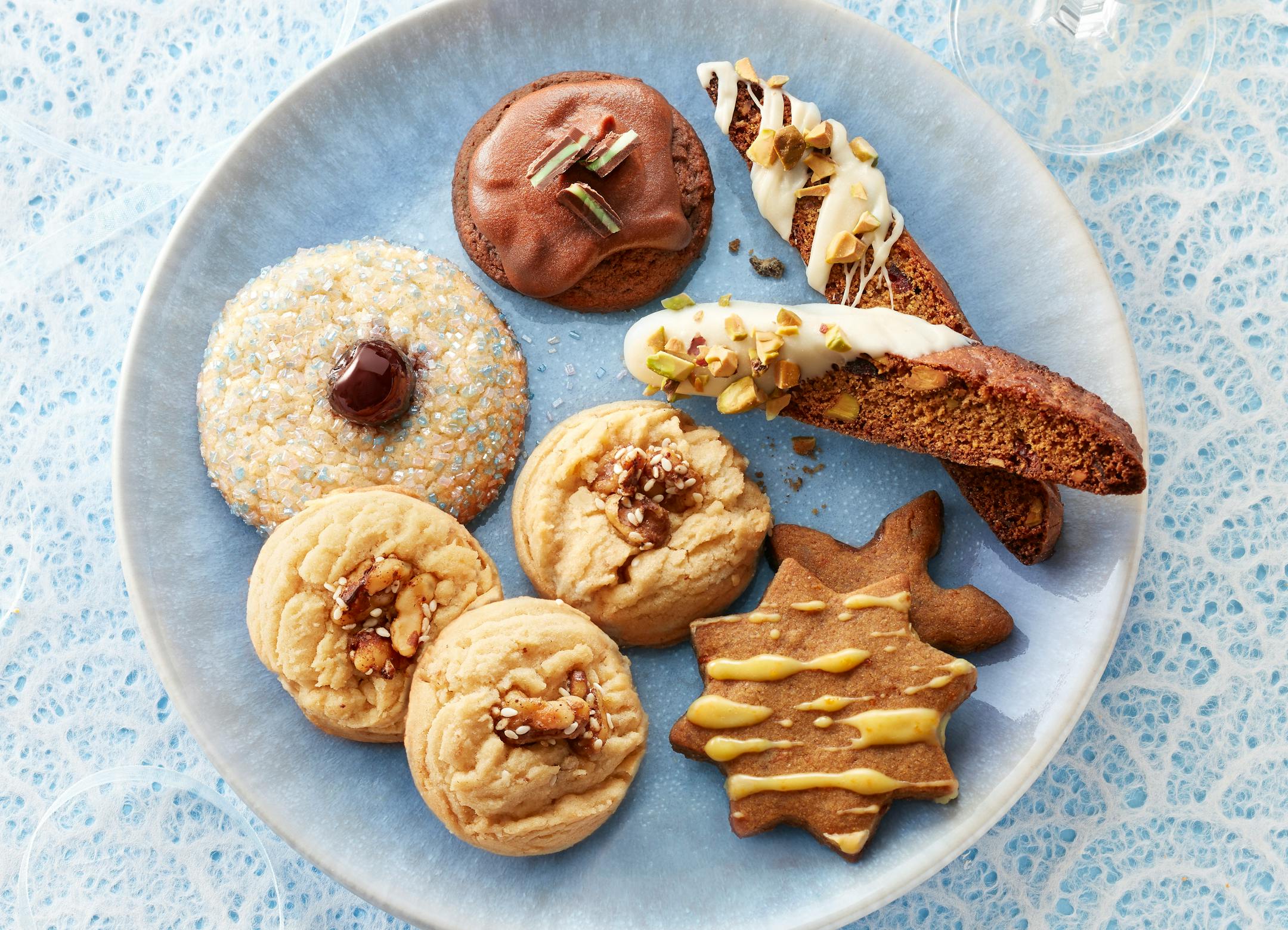 The winning cookies for the 2022 Star tribune Holiday Cookie Contest: Maple-Roasted Walnut Delights, Cherry Cardamom Buttons, Grasshoppers, Gingerbreaf Cornmeal Biscotti and Spiced Orange and Rye Shortbread Cookies. Photo by Dennis Becker and food styling by Lisa Golden Schroeder.