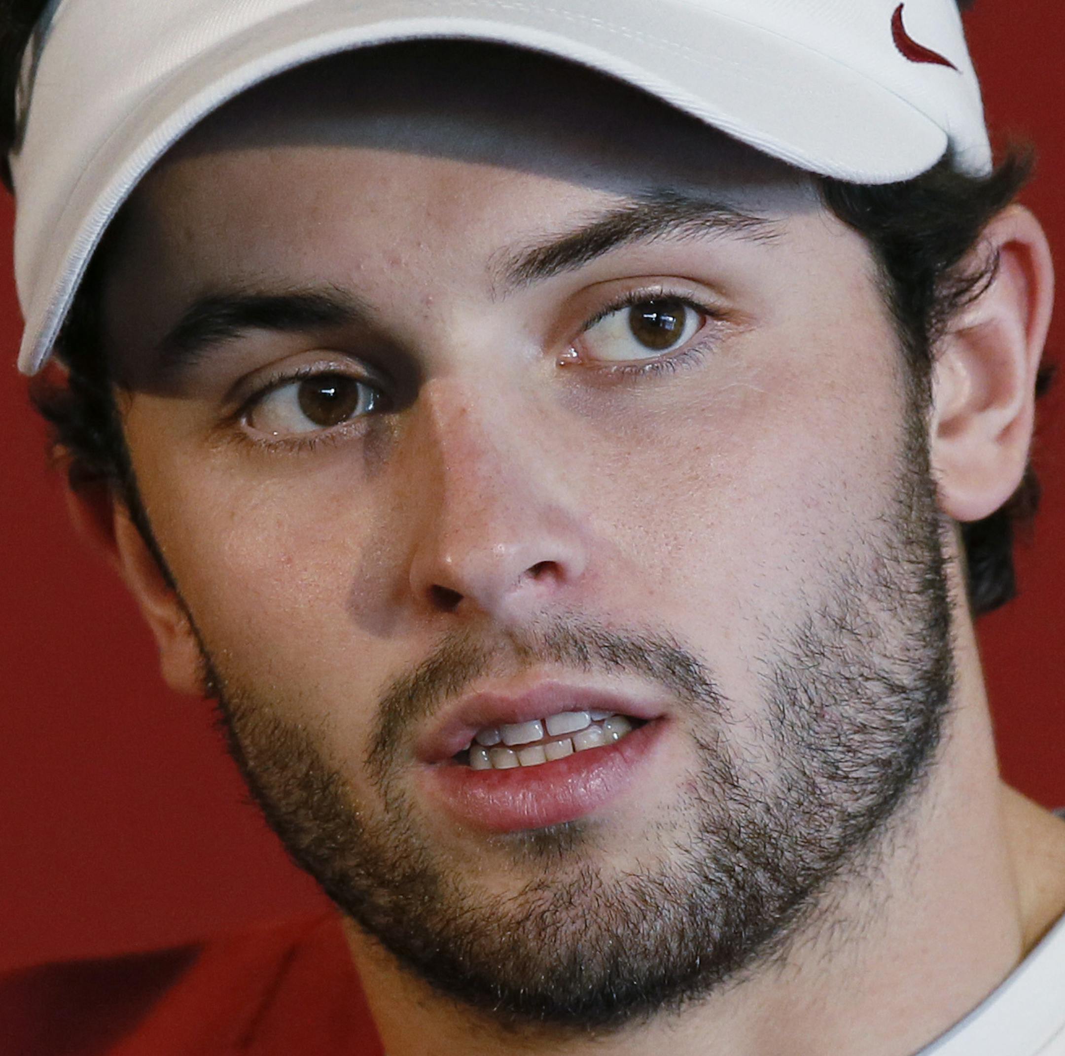Oklahoma starting quarterback Baker Mayfield talks to the media during an NCAA college football media day in Norman, Okla., Saturday, Aug. 6, 2016. The Oklahoma Sooners, fresh off an appearance in the College Football Playoff, believe a return trip is a legitimate possibility. (AP Photo/Sue Ogrocki) ORG XMIT: OKSO102