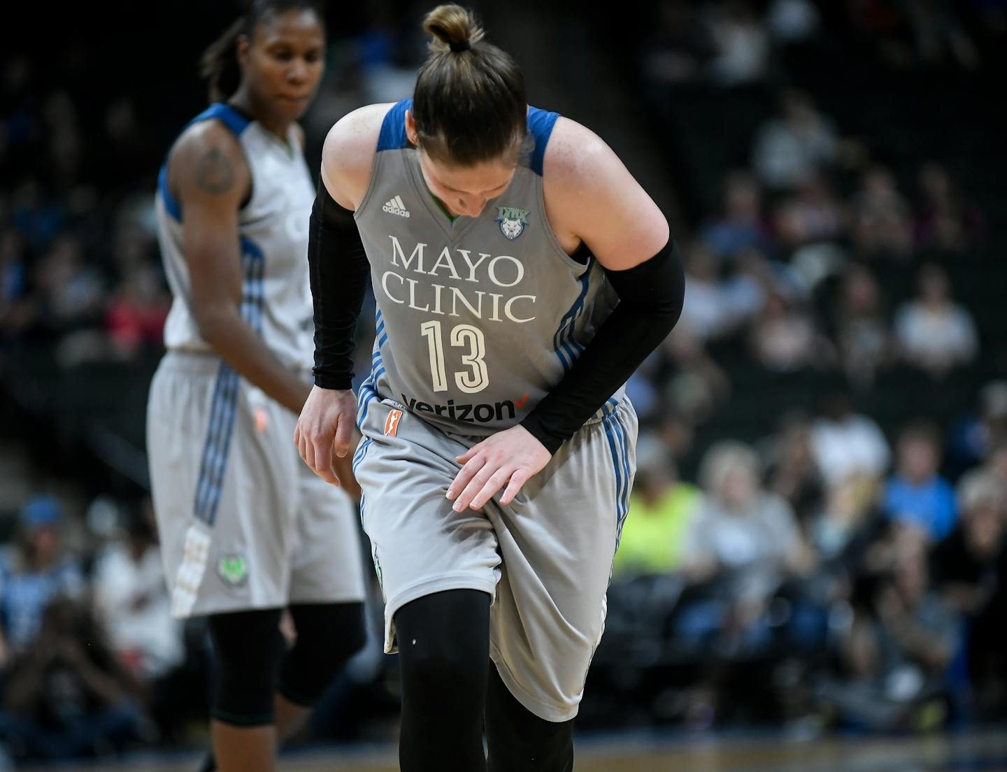 Minnesota Lynx guard Lindsay Whalen (13) winced in pain after injuring her left hand in the third quarter.