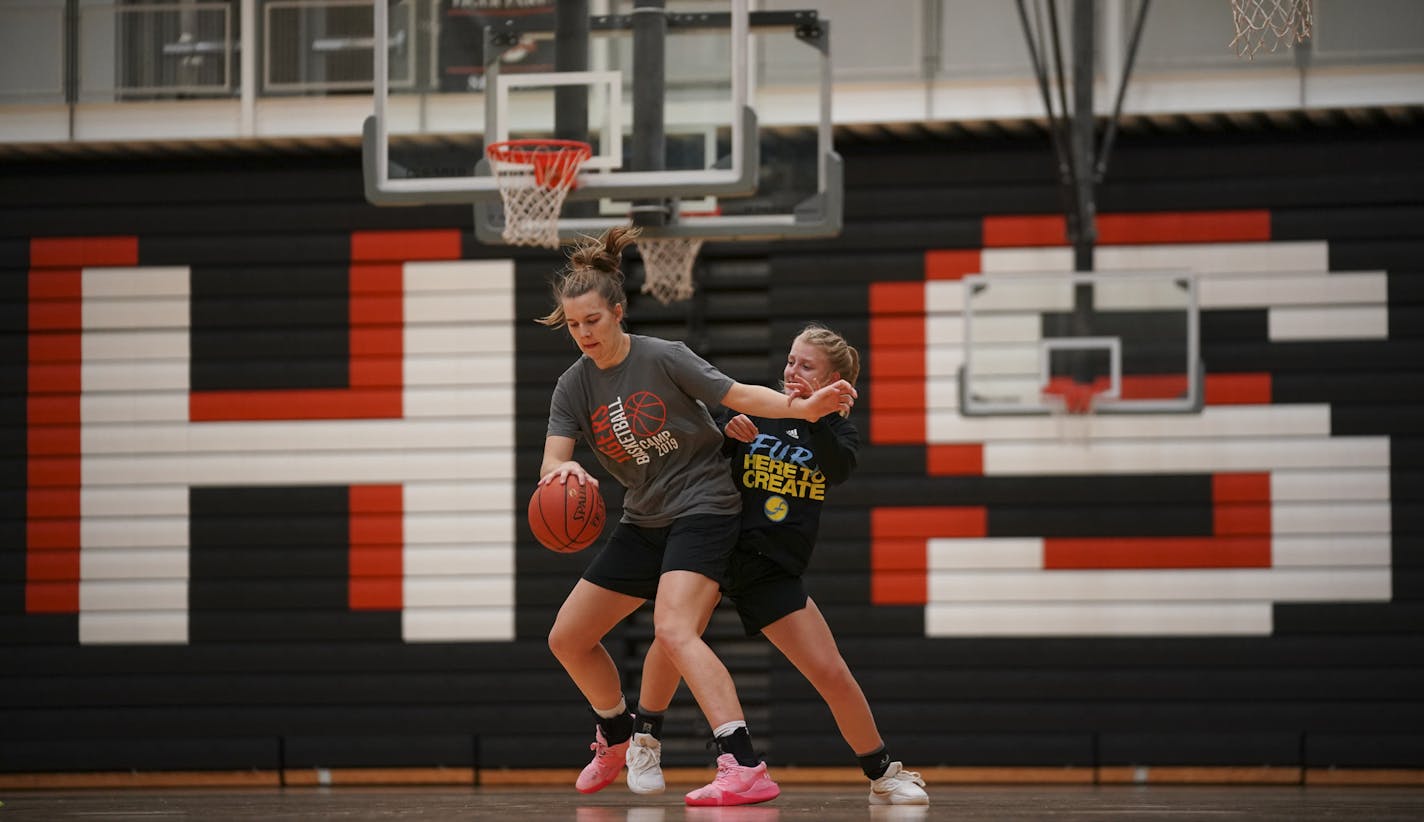 Sophie Hart, left, and Morgan Ebel while they took part in a drill during a captain's practice last month. ] JEFF WHEELER &#x2022; Jeff.Wheeler@startribune.com Farmington High School junior center Sophie Hart is one of the state's leading recruits. She worked out with teammates at a captain's practice in the high school gym Sunday night, October 27, 2019 in Farmington.