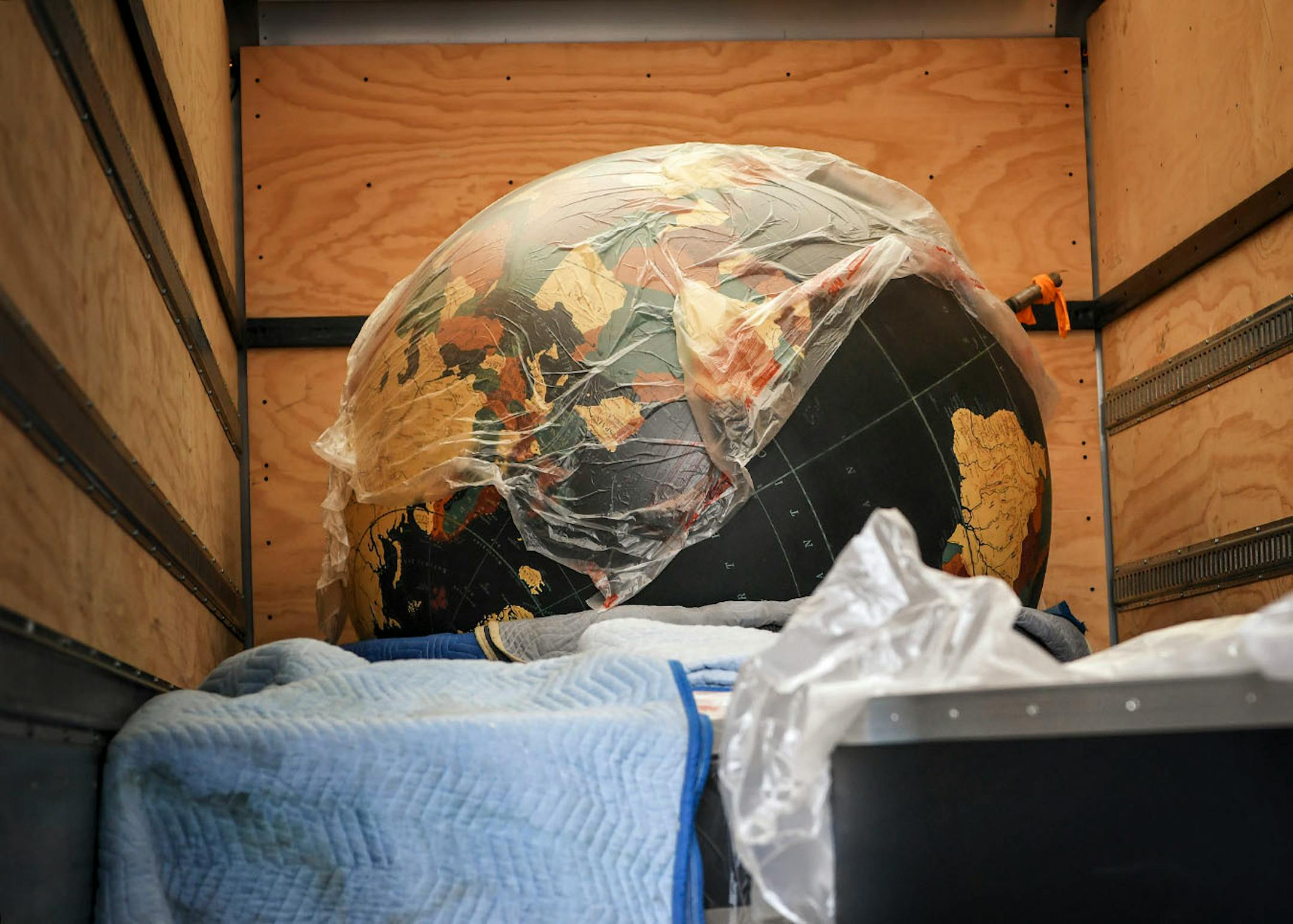 Workers from Blue Rhino Studio in Eagan handled the restoration and placement of the Star Tribune globe.