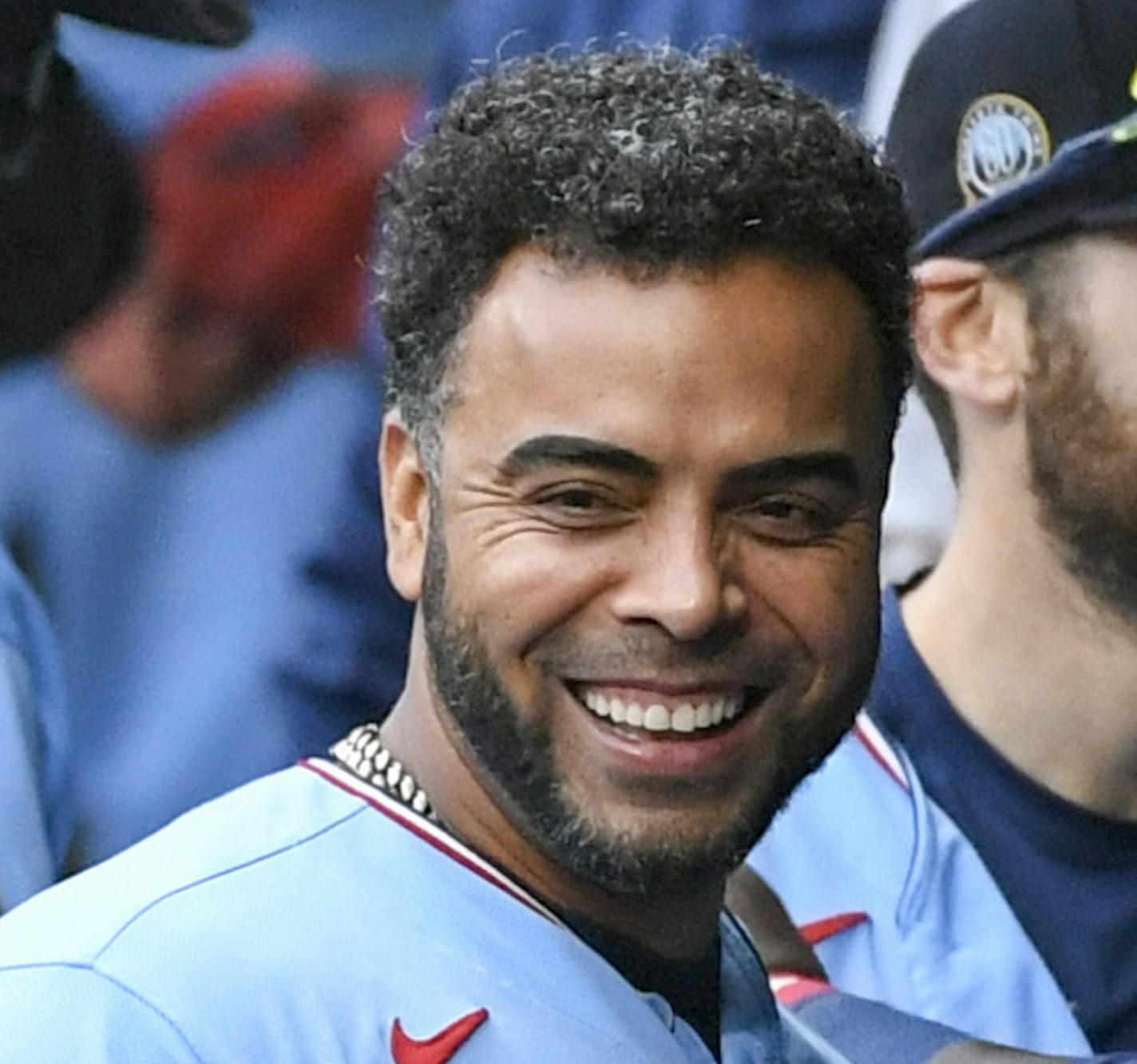 Minnesota Twins Minnesota Twins Nelson Cruz, center, smiles in the dugout after the Twins clinched the AL Central championship with the Chicago White Sox's loss during the tenth inning of a baseball game Sunday, Sept. 27, 2020, in Minneapolis. The Reds won 5-3. (AP Photo/Craig Lassig)