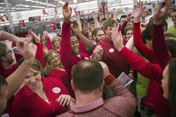 At the Ridgedale Target in Minnetonka, employees joined for the team huddle before the Target store opened for Black Friday at 6 o'clock .