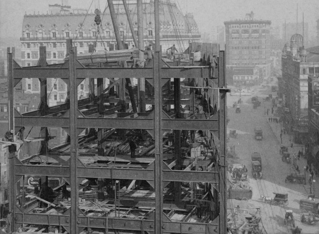 Workers constructing the steel-framed Times Building in New York in 1904.