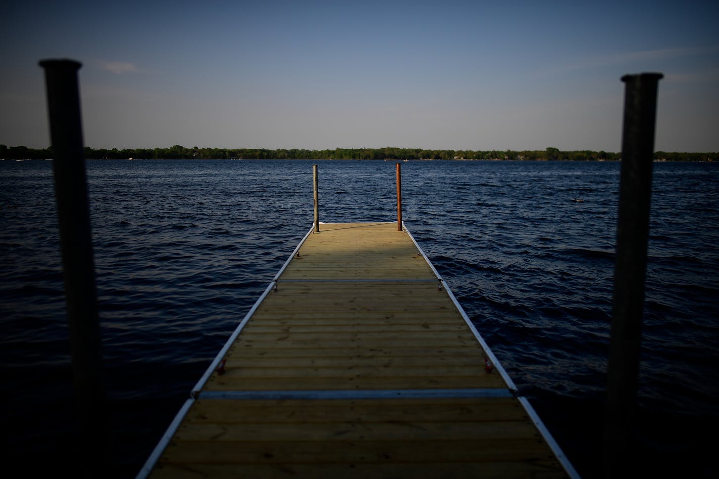 The sun began to set on White Bear lake Thursday evening. ] AARON LAVINSKY &#xef; aaron.lavinsky@startribune.com Cities across the east metro are fighting efforts to rein in their groundwater use stemming from a lawsuit over White Bear Lake. About a dozen communities are challenging Department of Natural Resources orders to they impose residential irrigation plans during certain periods and develop plans to switch over to river or lake water. The fight illustrates how difficult it is to corral t