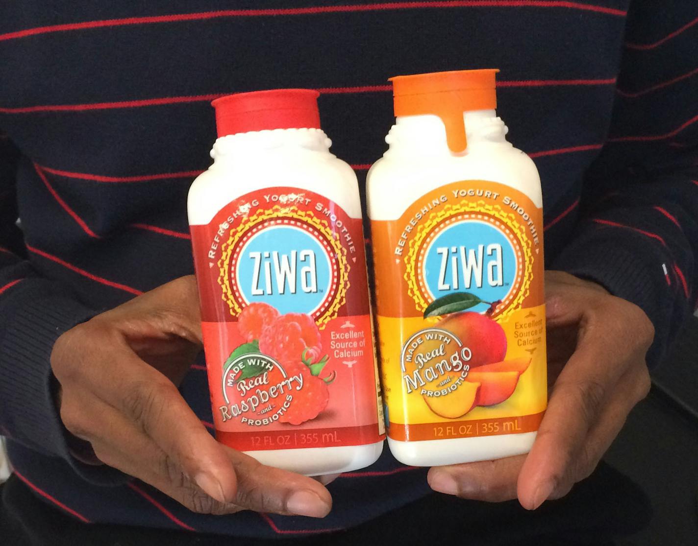 Mohamed Ismail, founder of Acacia-TreeBev.com, displays a couple of offerings from his Ziwa line of yogurt smoothies.