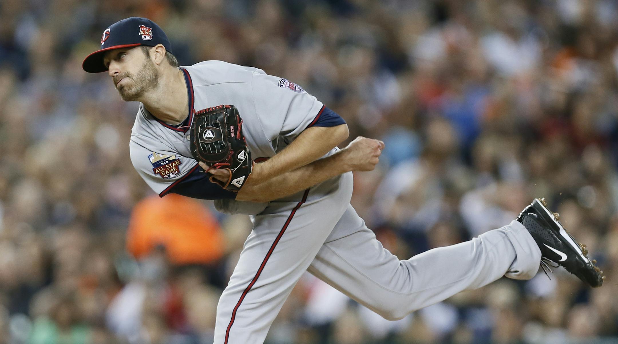 Minnesota Twins relief pitcher A.J. Achter throws against the Detroit Tigers in the fifth inning of a baseball game in Detroit Friday, Sept. 26, 2014. (AP Photo/Paul Sancya)