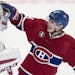 Montreal Canadiens goalie Carey Price is congratulated by teammate Brendan Gallagher following their 4-3 victory over the Detroit Red Wings during ove
