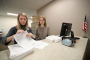 Election interns Haley Johnson (left) and Silence Marsh counted the petitions dropped off at the Ramsey County Elections Office in St. Paul.