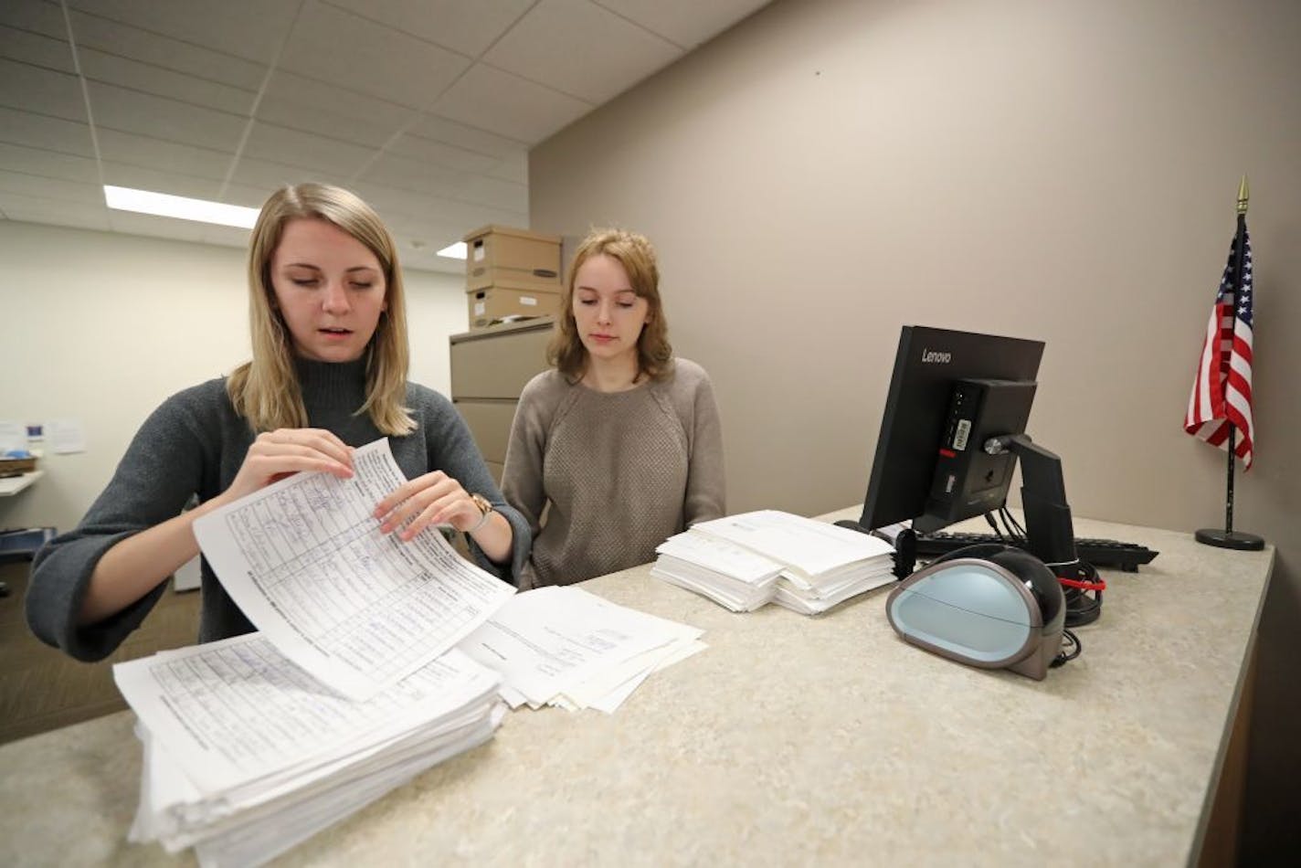 Election interns Haley Johnson (left) and Silence Marsh counted the petitions dropped off at the Ramsey County Elections Office in St. Paul.