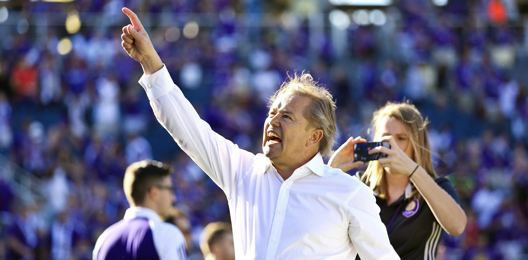Orlando City coach Adrian Heath celebrates with the fans after the end of the game where Orlando City tied with two goals in the final minutes of stoppage time during their season opener against Real Salt Lake at the Citrus Bowl on Sunday, March 6, 2016. The game ended in a 2-2- tie. (Jacob Langston/Orlando Sentinel) ORG XMIT: ORL1603061627428641 ORG XMIT: MIN1611171524130482