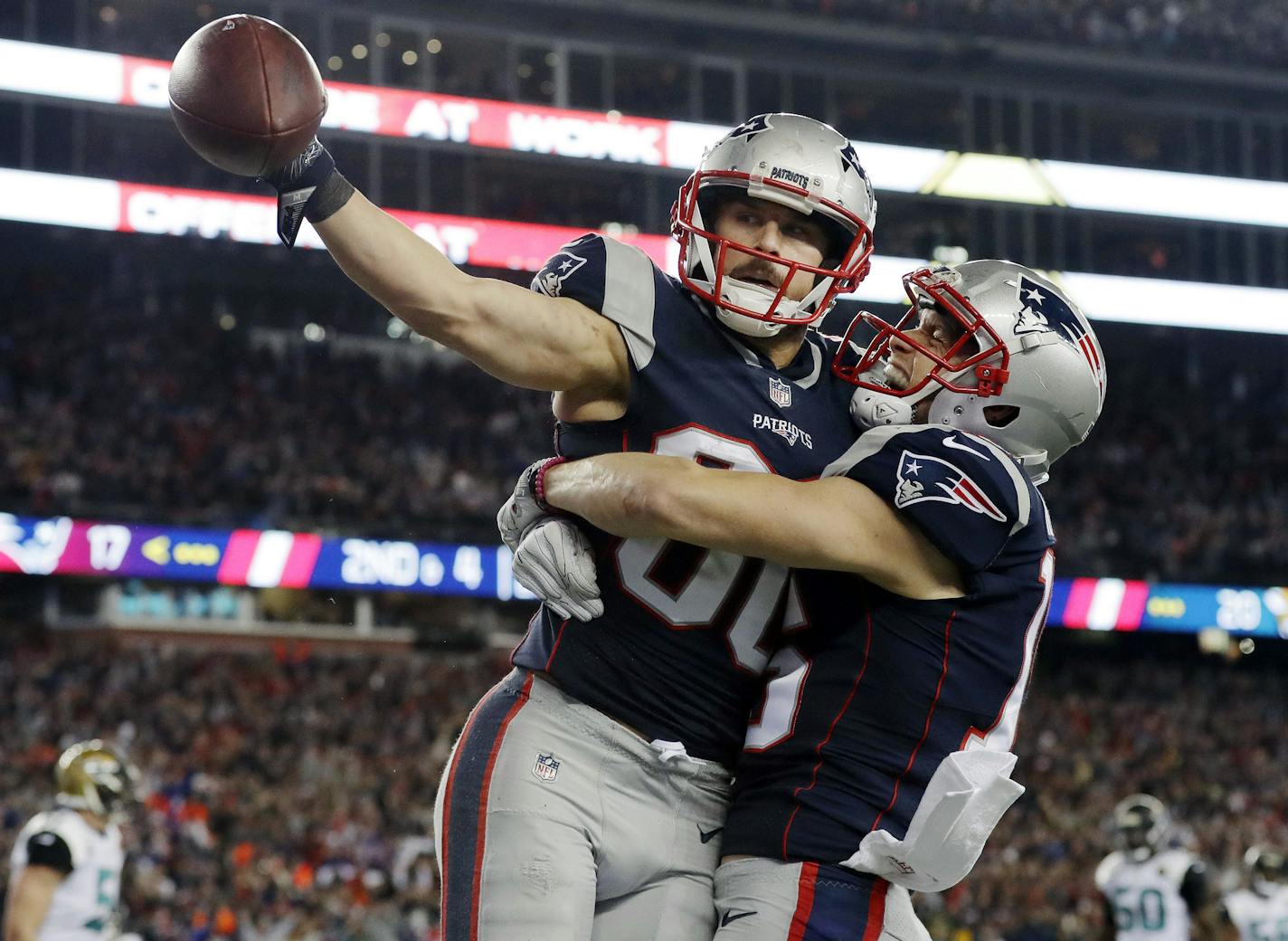 New England Patriots wide receiver Danny Amendola, left, celebrates his touchdown catch with Chris Hogan, right, during the second half of the AFC championship NFL football game against the Jacksonville Jaguars, Sunday, Jan. 21, 2018, in Foxborough, Mass. (AP Photo/David J. Phillip)