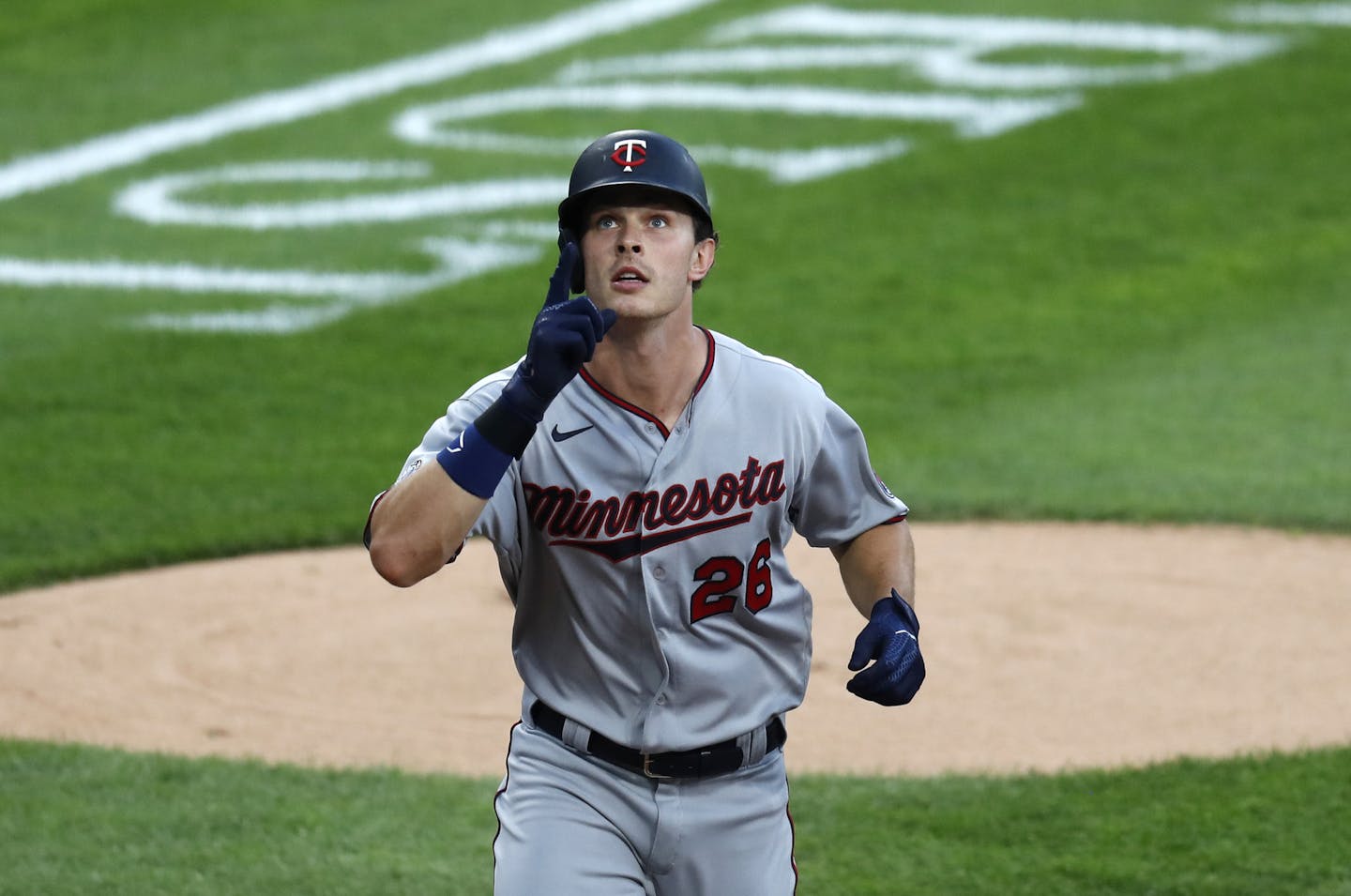 Minnesota Twins' Max Kepler celebrates his second home run off Chicago White Sox starting pitcher Lucas Giolito, during the second inning of a baseball game Friday, July 24, 2020, in Chicago. (AP Photo/Charles Rex Arbogast)