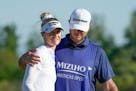 Nelly Korda is hugged by caddie Jason McDede on the 18th green during the final round of the Mizuho Americas Open on Sunday in Jersey City, N.J.