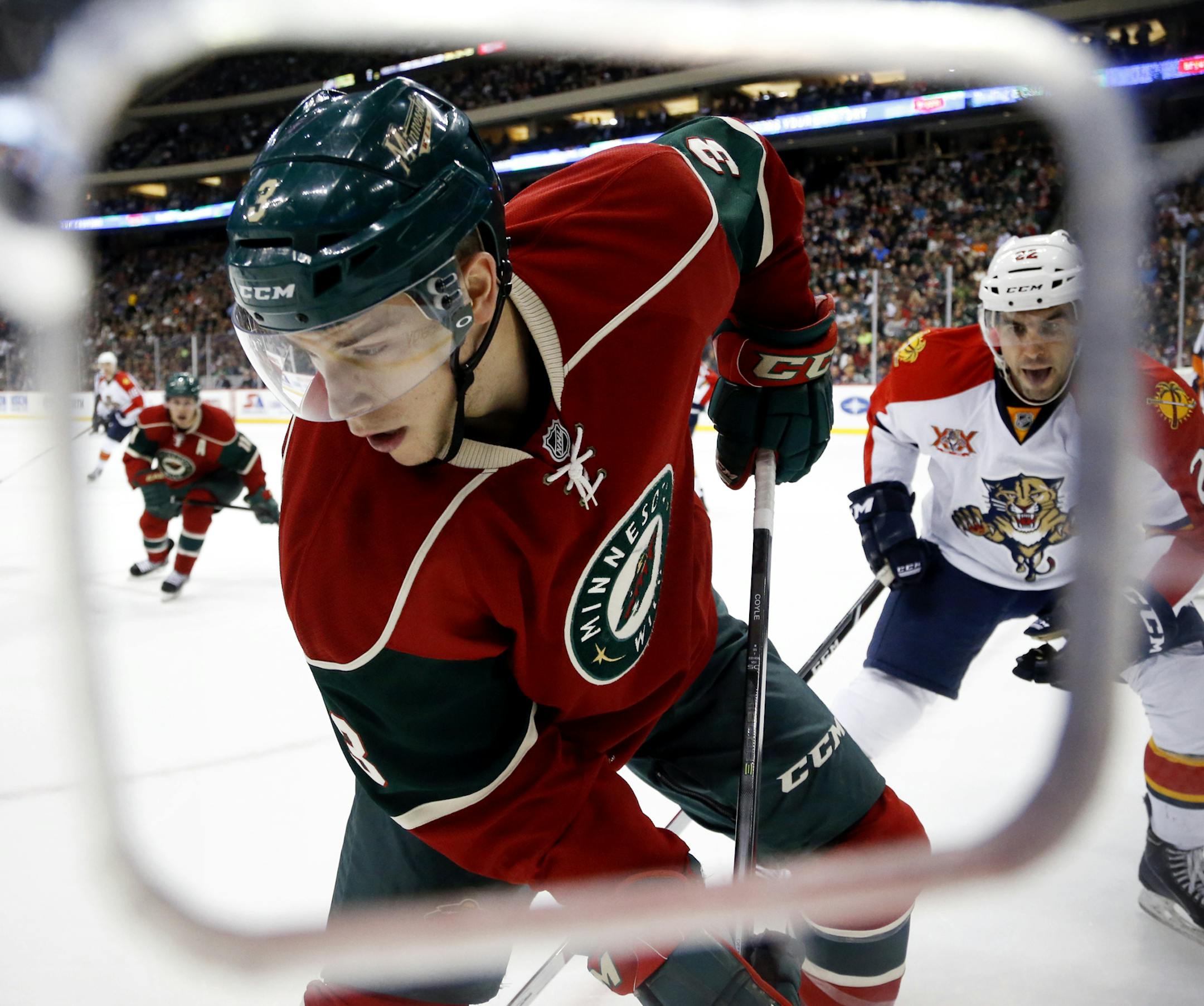 During the first period, with Florida's Mike Mottau (22) in pursuit, the Minnesota Wild's Charlie Coyle goes into the corner for the puck at the Xcel Energy Center Friday, Nov. 15, 2013, in St. Paul, MN.](DAVID JOLES/STARTRIBUNE) djoles@startribune.com Florida at the Minnesota Wild at the Xcel Energy Center Friday, Nov. 15, 2013, in St. Paul, MN.]