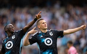 Minnesota United forward Bongokuhle Hlongwane, left, celebrates with midfielder Robin Lod during the team's win over Inter Miami on May 10.
