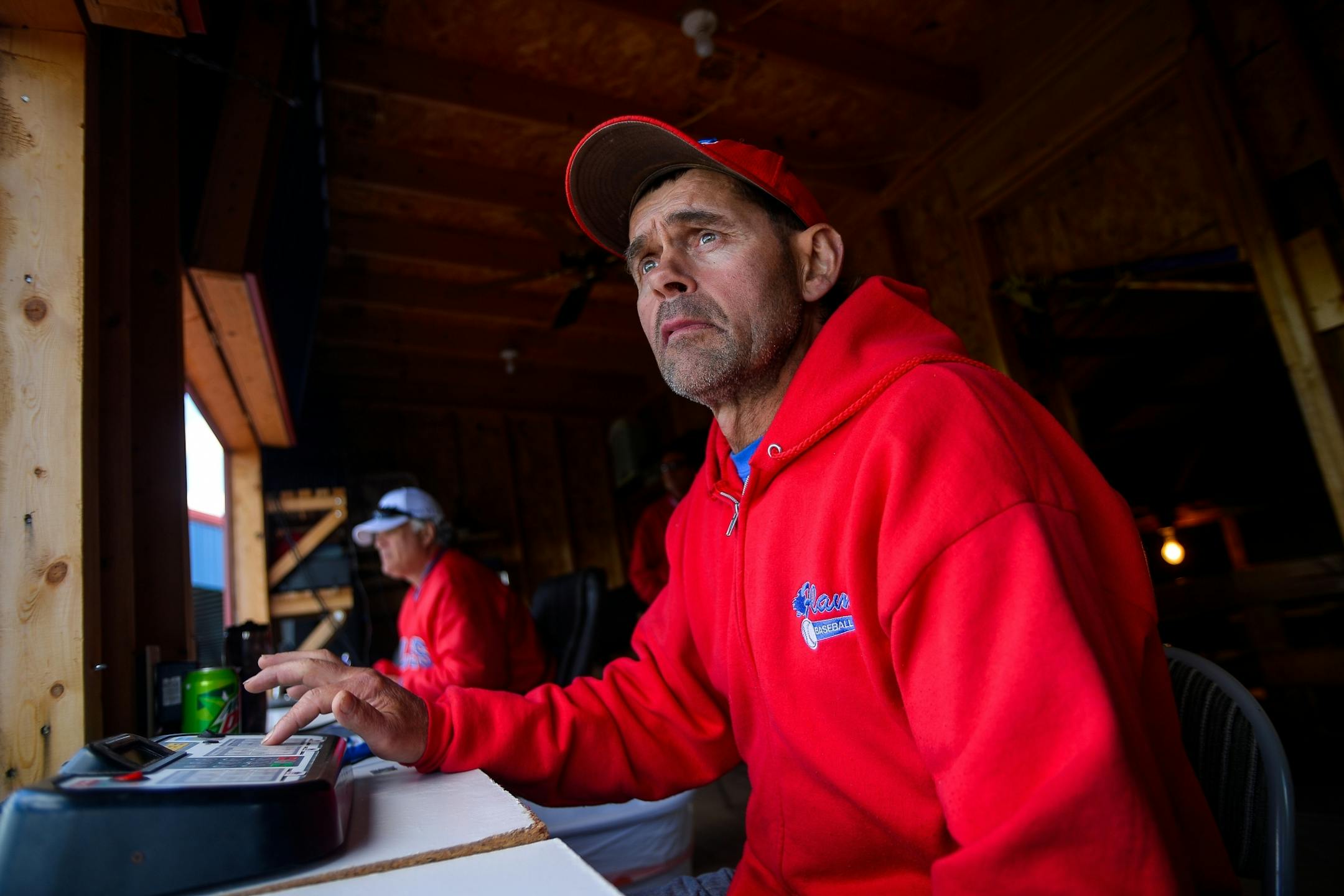 Mike Schleper, the president of the Farming Baseball Association, ran the scoreboard during the Farming Invitational Tournament championship game between the Sartell Muskies and St. Joseph on Sunday, June 25, 2017 in Farming, Minn. Farming's baseball field is named after Schleper's father and brothers, who played on the team in the 1940s.