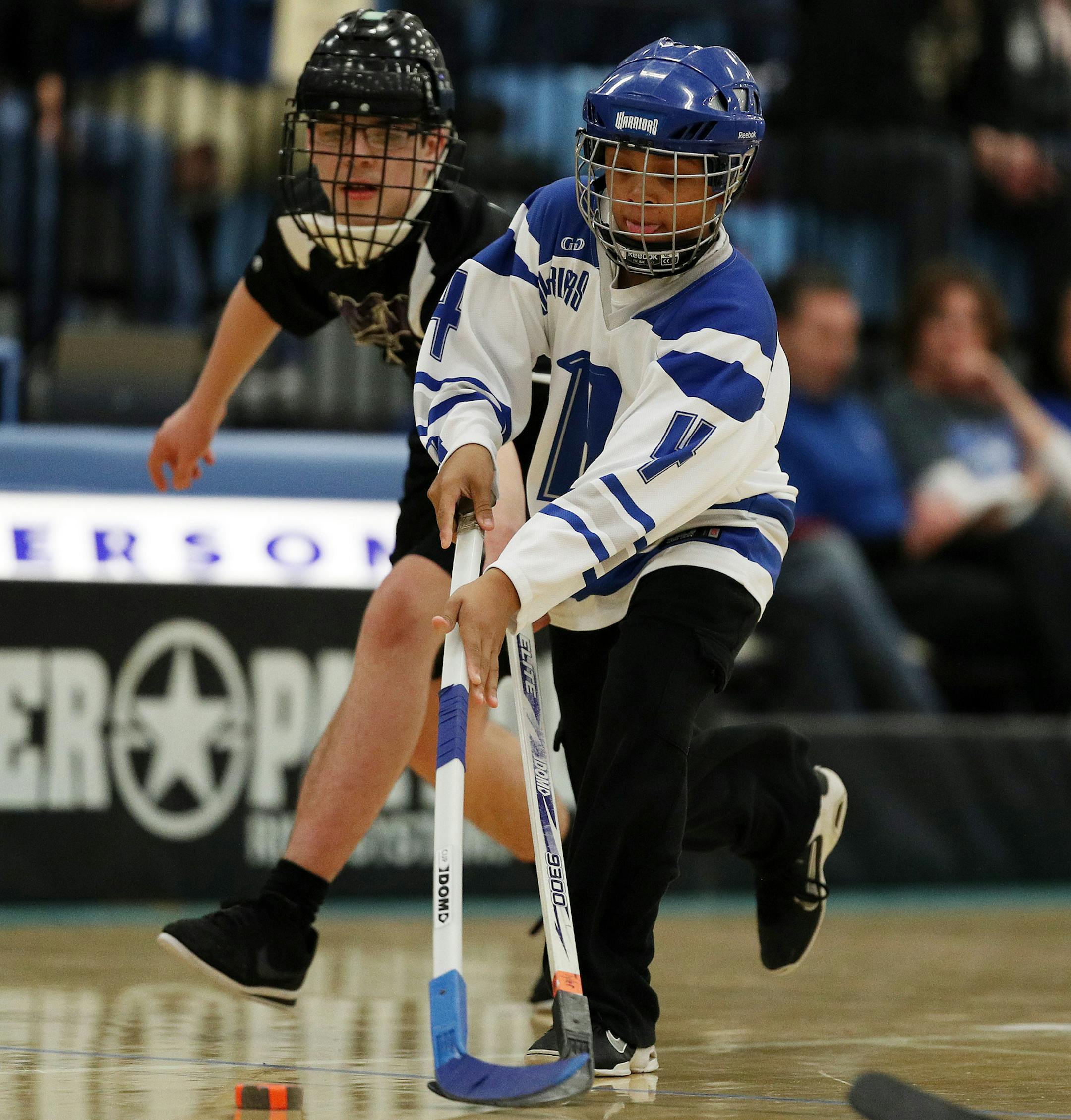 Brainerd/Pillager's Tre'Von Otey (4) took the puck to the goal during the PI division game. ] ANTHONY SOUFFLE &#xef; anthony.souffle@startribune.com Players competed during the adapted floor hockey state tournament championship games Saturday, March 18, 2017 at Jefferson High School in Bloomington, Minn.