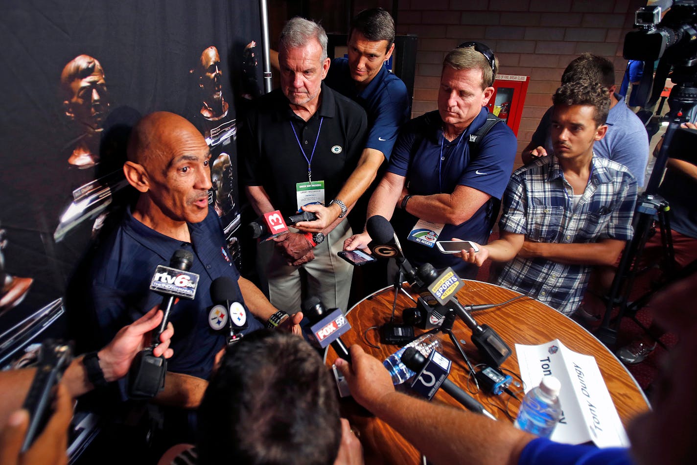 Tony Dungy talks with reporters in 2016