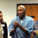O.J. Simpson reacts after learning he would be granted parole, at a hearing at the Lovelock Correctional Center in Nevada, July 20, 2017. Simpson will