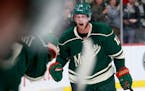 Eric Staal celebrates near the Wild bench after scoring the go-ahead goal in the season's home opener against Winnipeg.