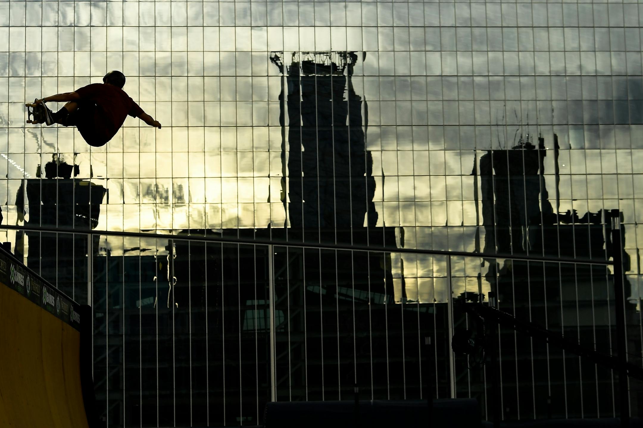 Sandro Dias, of Brazil, competed in the first heat of the vert qualifiers Wednesday night with the reflection of downtown Minneapolis on US Bank Stadium behind him.