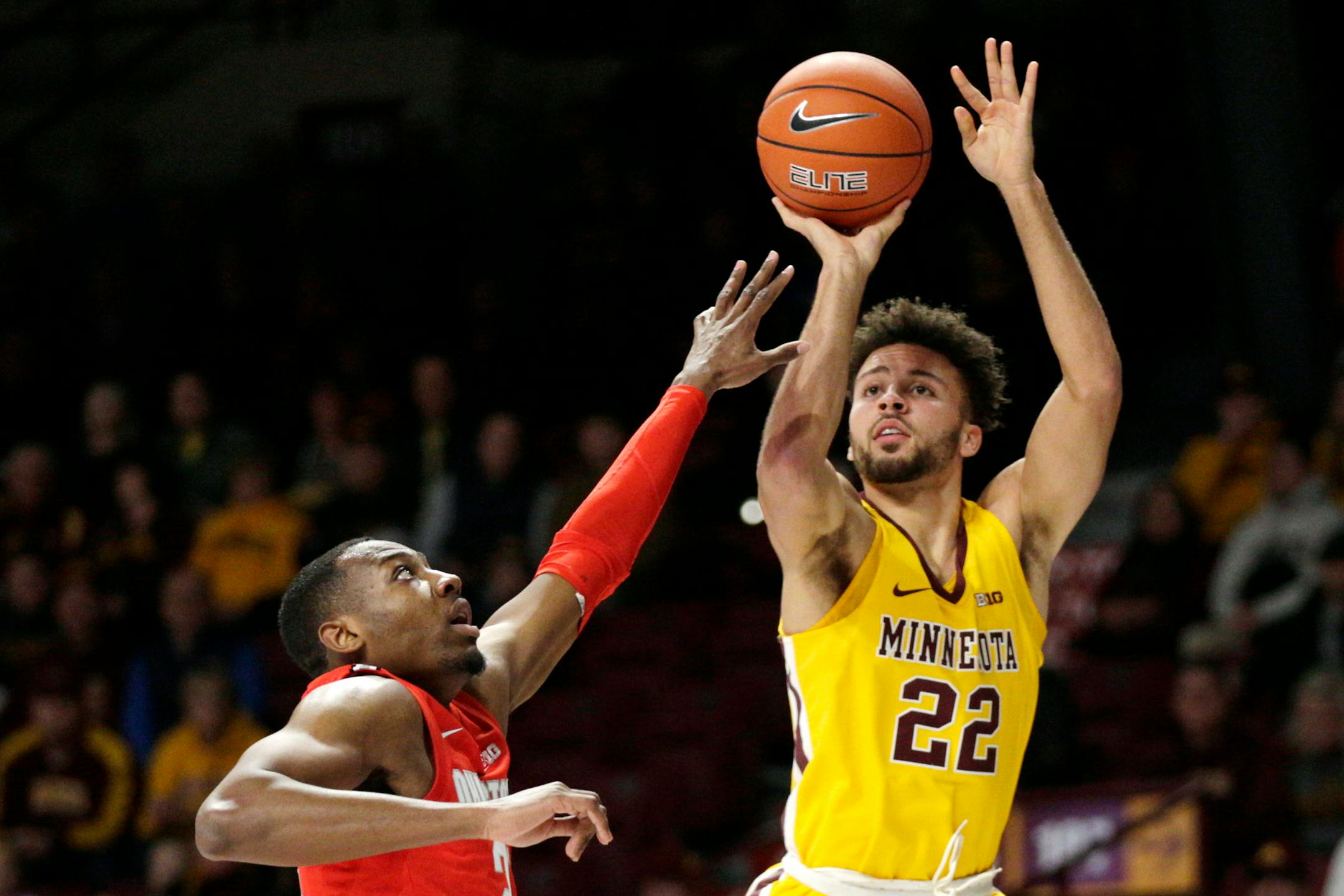 Gophers guard Gabe Kalscheur shot over Ohio State guard D.J. Carton in the first half of the Gophers' 84-71 upset of the No. 3 Buckeyes on Sunday.