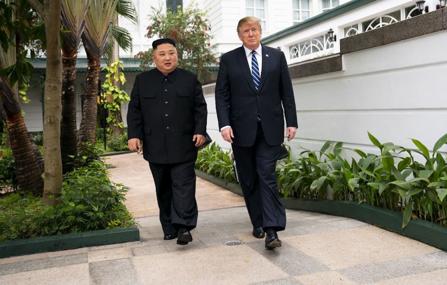 President Donald Trump and Kim Jong Un, the North Korean leader, walk together to a meeting at the Metropole Hotel in Hanoi, Vietnam, Feb. 28, 2019.