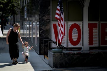 Christie Berkseth-Rojas with her daughter Sophie 2, walked out of the Early Vote Center after voting early in the primary election Monday August 6, 20