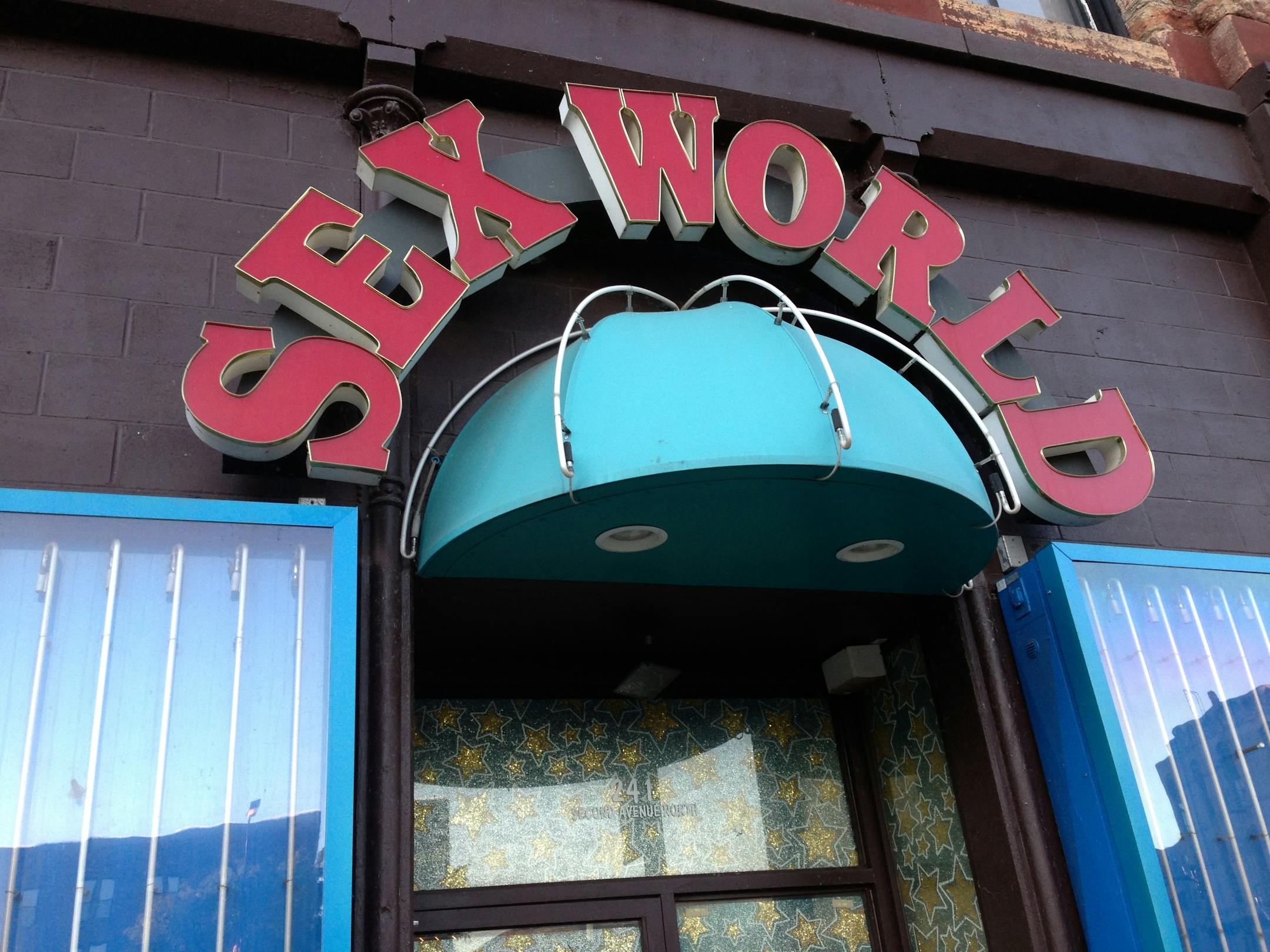 A woman was shot outside Sex World in downtown Minneapolis early Monday.