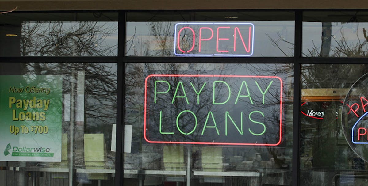 ** FILE ** In this Jan. 23, 2009, file photo a Dollarwise payday loan store is open in Kent, Wash.