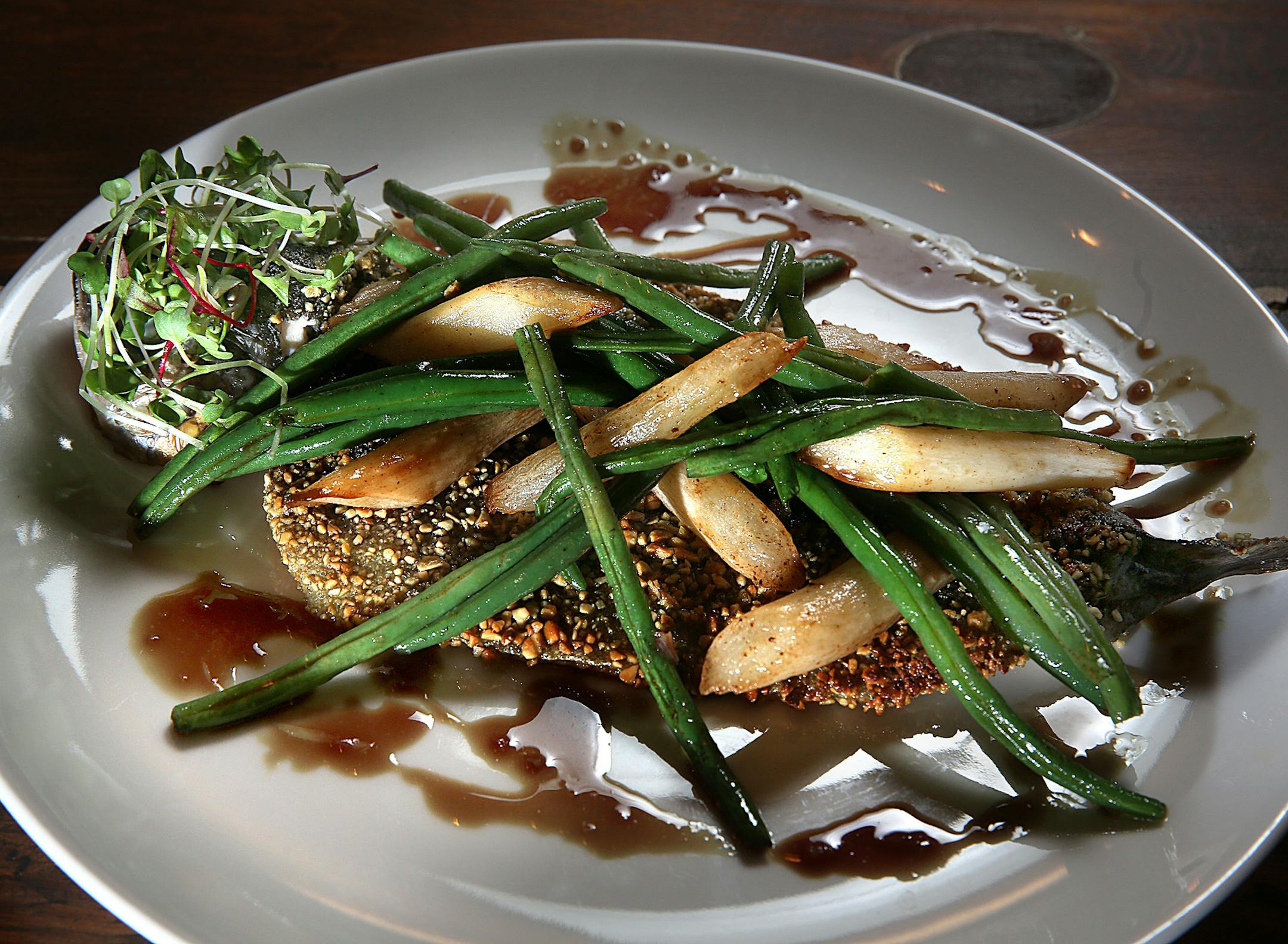 Rainbow trout with pumpkin seeds, green beans, caramelized salsify.