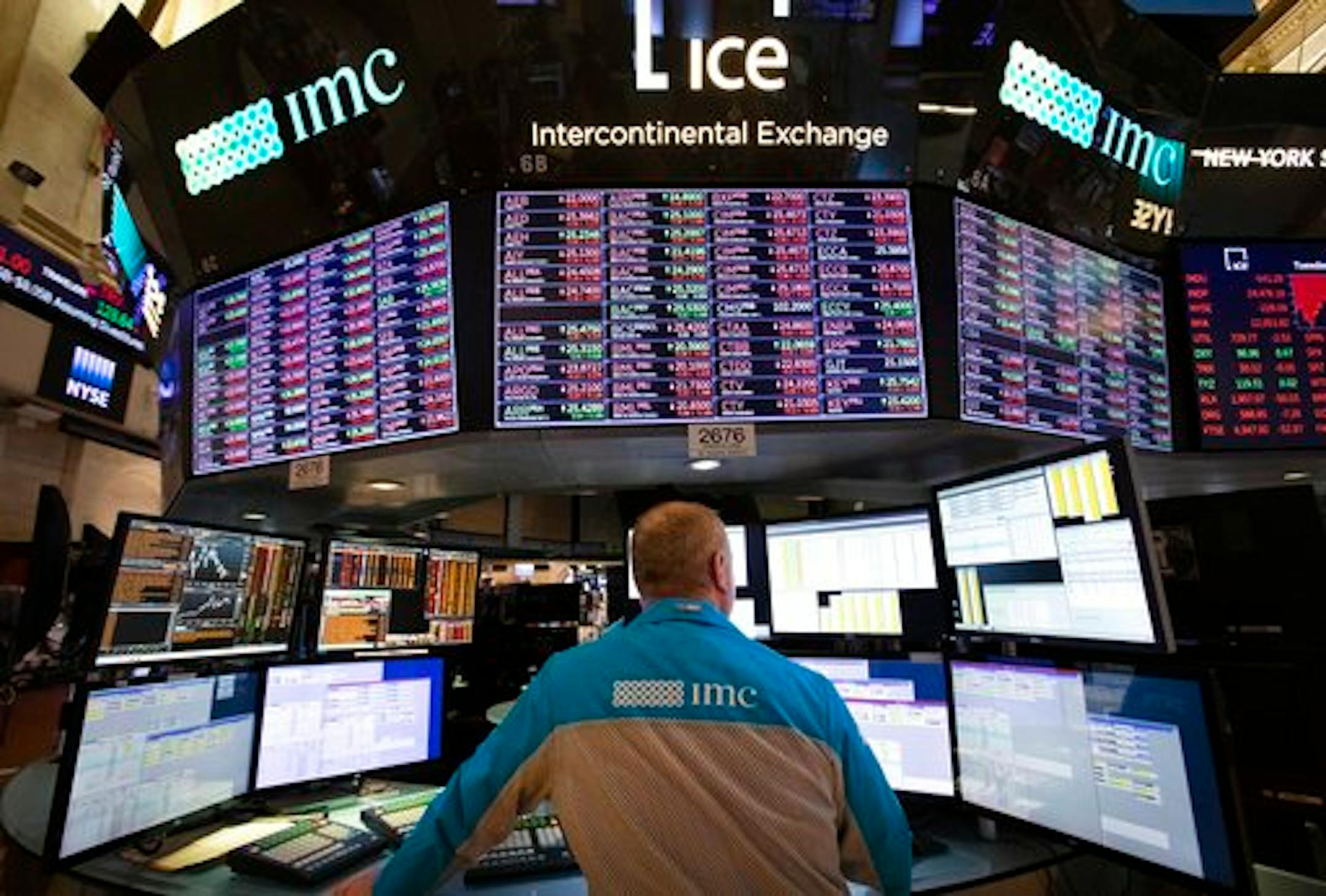 FILE - In this Tuesday, Nov. 20, 2018, file photo, a trader works at the New York Stock Exchange. Corporations' appetite for buying back their own stock has hit a record high. Stock buybacks by companies in the S&P 500 climbed to $194.07 billion in the third quarter, according to data from S&P Dow Jones Indices. (AP Photo/Mark Lennihan, File)