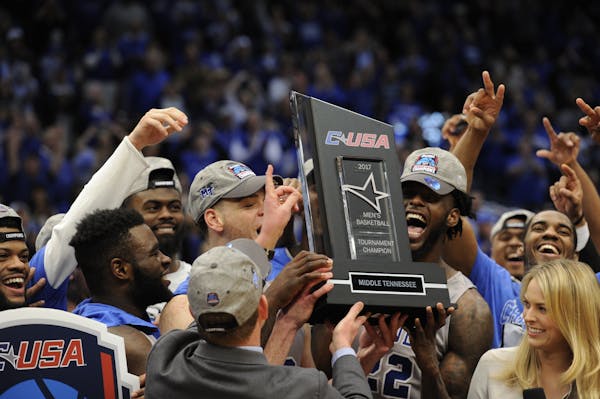 Middle Tennessee players celebrated their victory over Marshall in the championship game of the Conference USA tournament on Saturday.