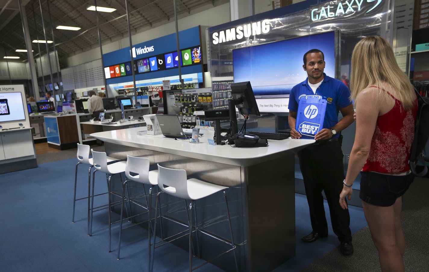 With its recent partnerships with Samsung and Microsoft, Best Buy has been one of the most aggressive proponent of the store within a store concept. Best Buy employee Phillip Stewart chatted with customer Karen Karpenko in the Samsung store in Best Buy in Richfield, Minn. on Wednesday, July 10, 2013.