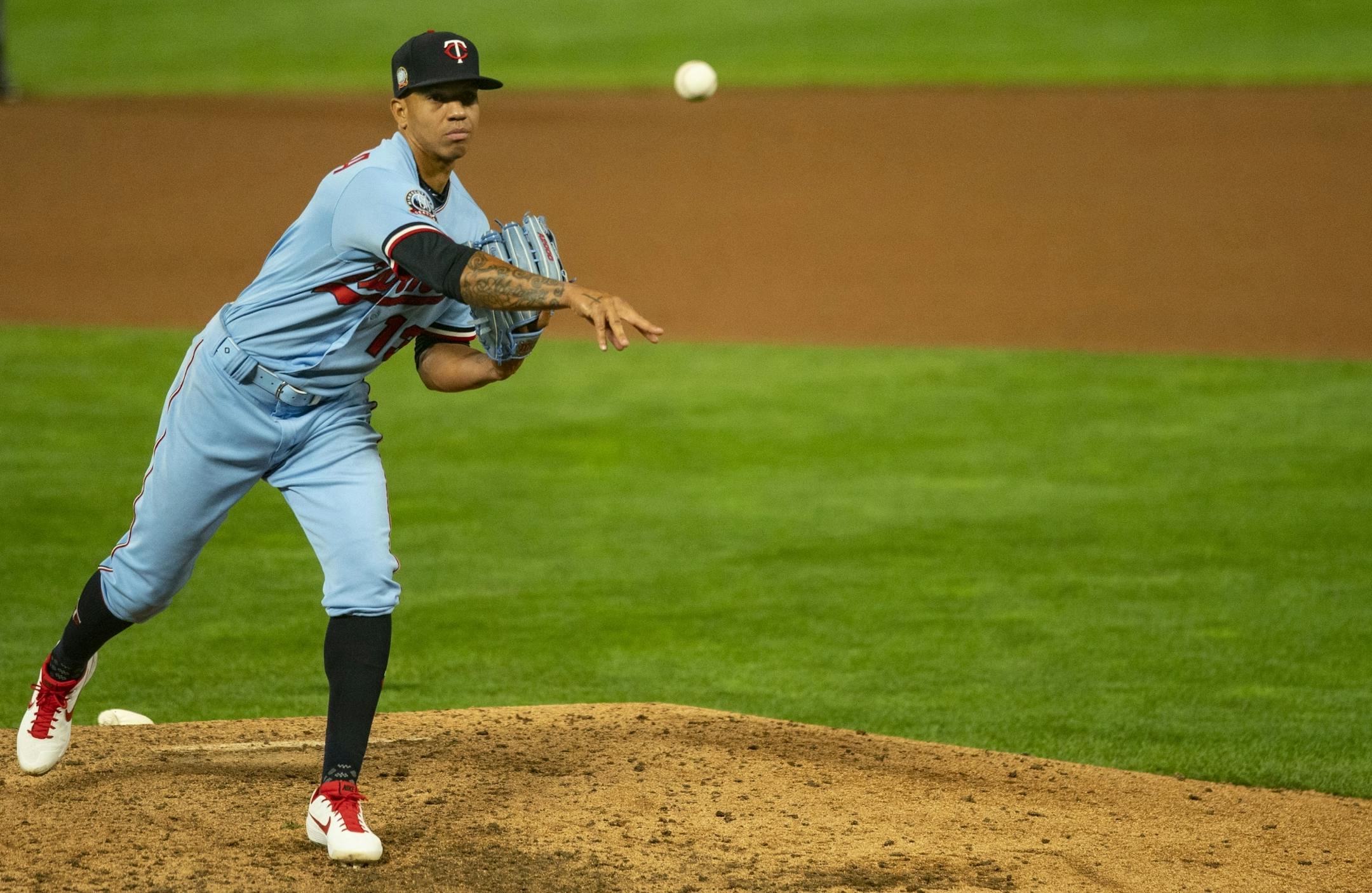 Minnesota Twins third baseman Ehire Adrianza (13) was put on the pitcher's mound in the ninth inning with the Twins down 8-1. He gave up one run.