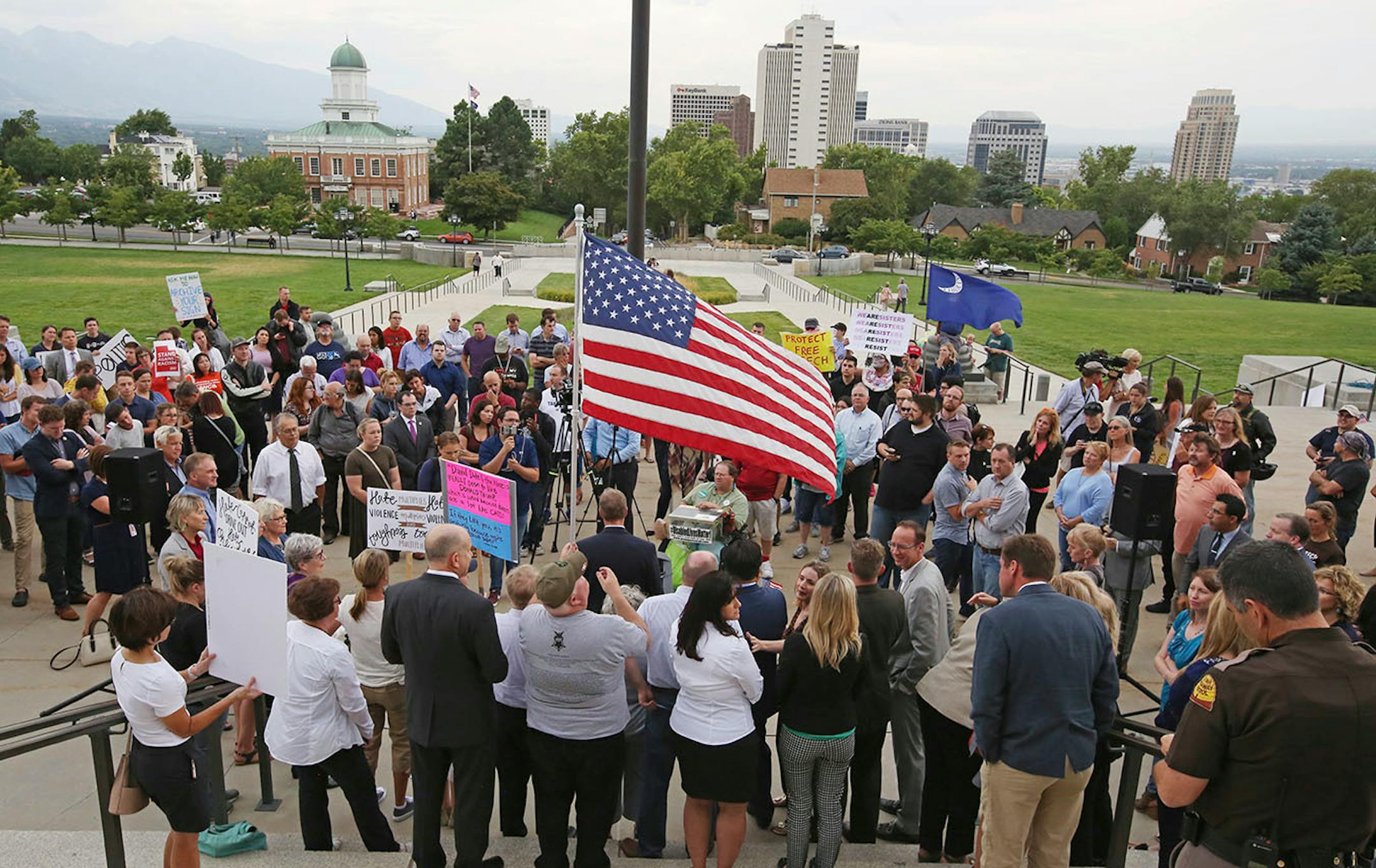 People gather for a rally Monday, Aug. 14, 2017, in Salt Lake City. Utah residents held a unity and anti-racism rally Monday night to denounce the messages of hate and violence of white supremacists at a weekend rally in Charlottesville, Virginia.