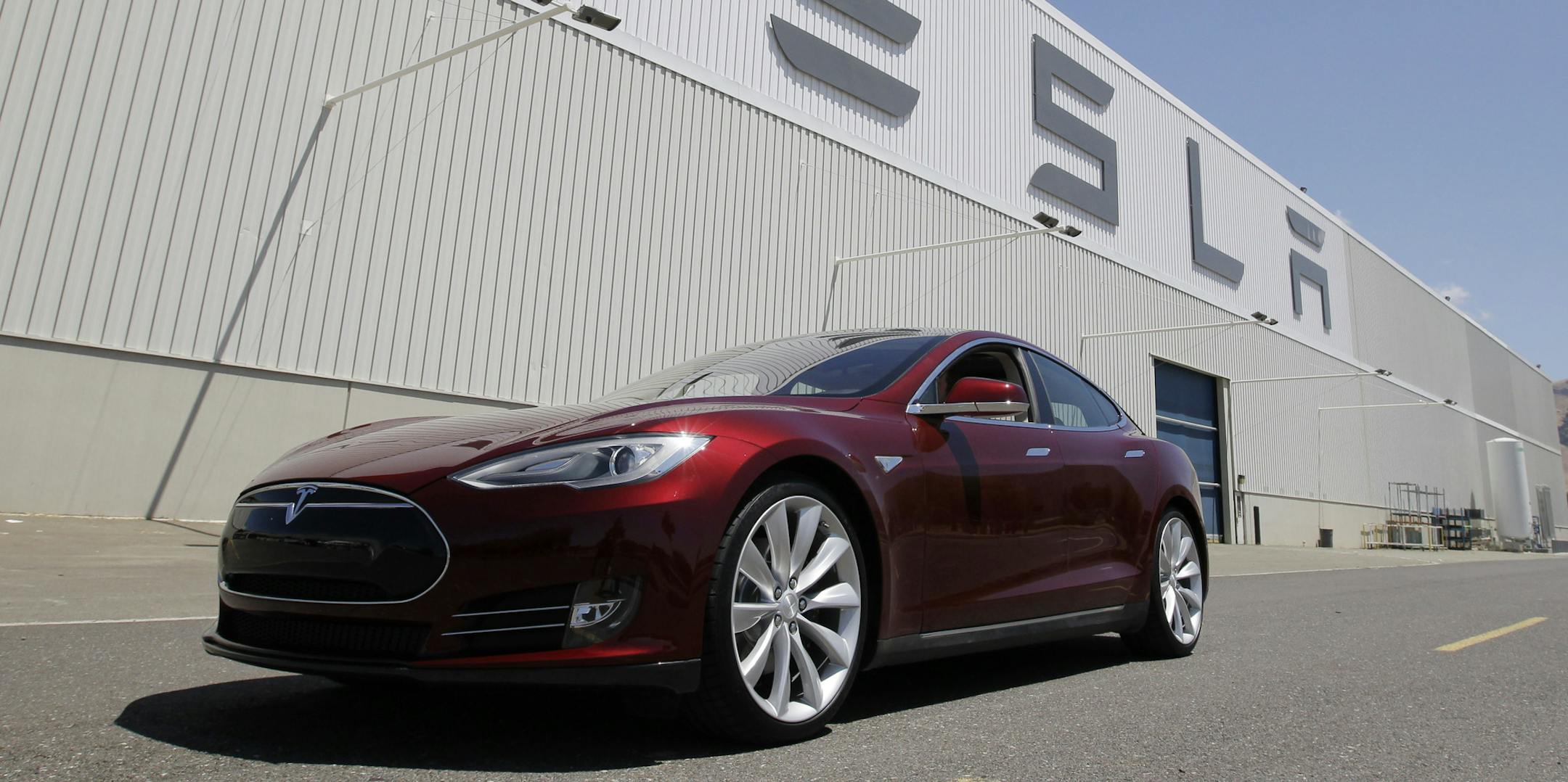 FILE - This June 22, 2012 file photo shows a Tesla Model S outside the Tesla factory in Fremont, Calif. The Tesla Model S electric sedan is Consumer Reportsí top pick in this yearís automotive survey. (AP Photo/Paul Sakuma, File)