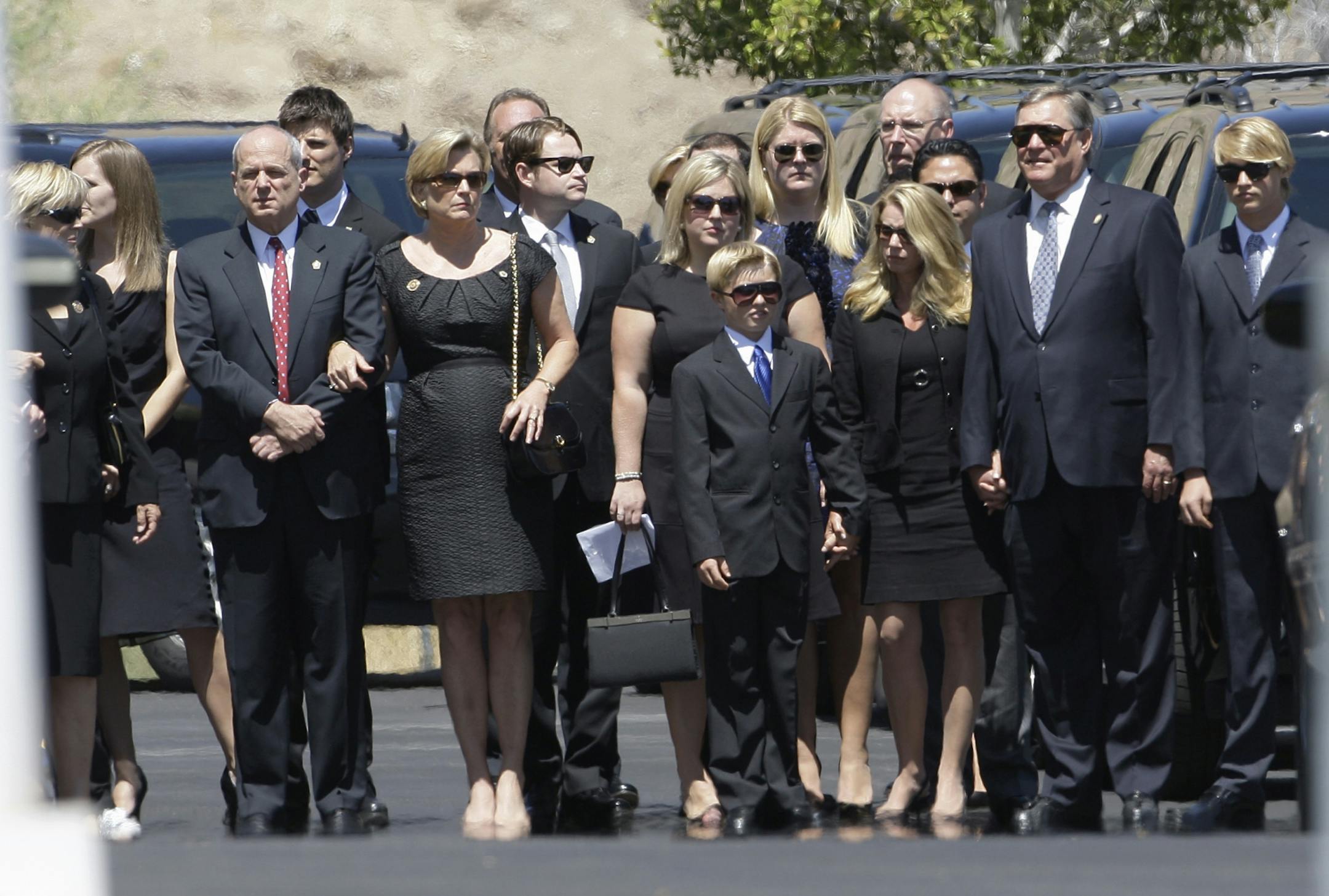Members of the Ford family, including son Jack, second from right, arrive behind the hearse for the funeral of former first lady Betty Ford, Tuesday, July 12, 2011, at St. Margaret's Episcopal Church in Palm Desert, Calif.