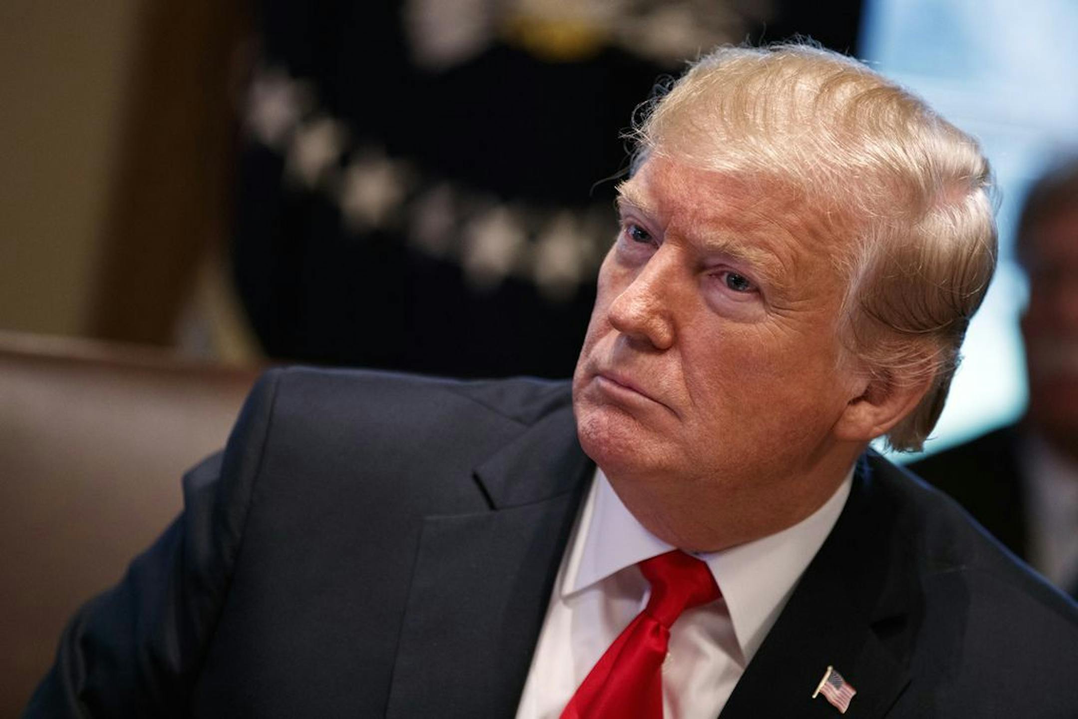 President Donald Trump listens during a cabinet meeting at the White House, Wednesday, Jan. 2, 2019, in Washington.