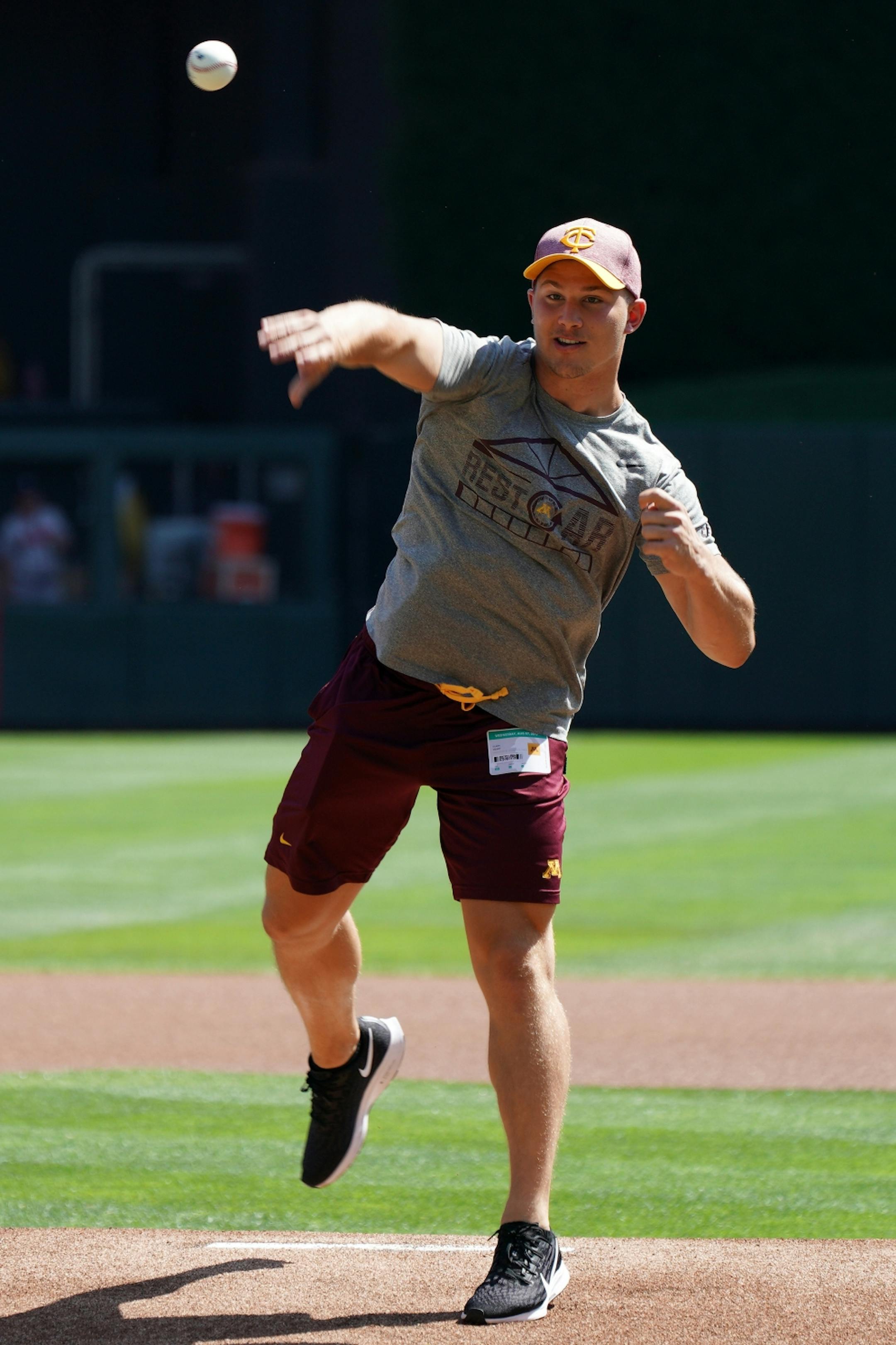 Gophers wide receiver Clay Geary (18) threw out a ceremonial first pitch ahead of Wednesday's Twins game.