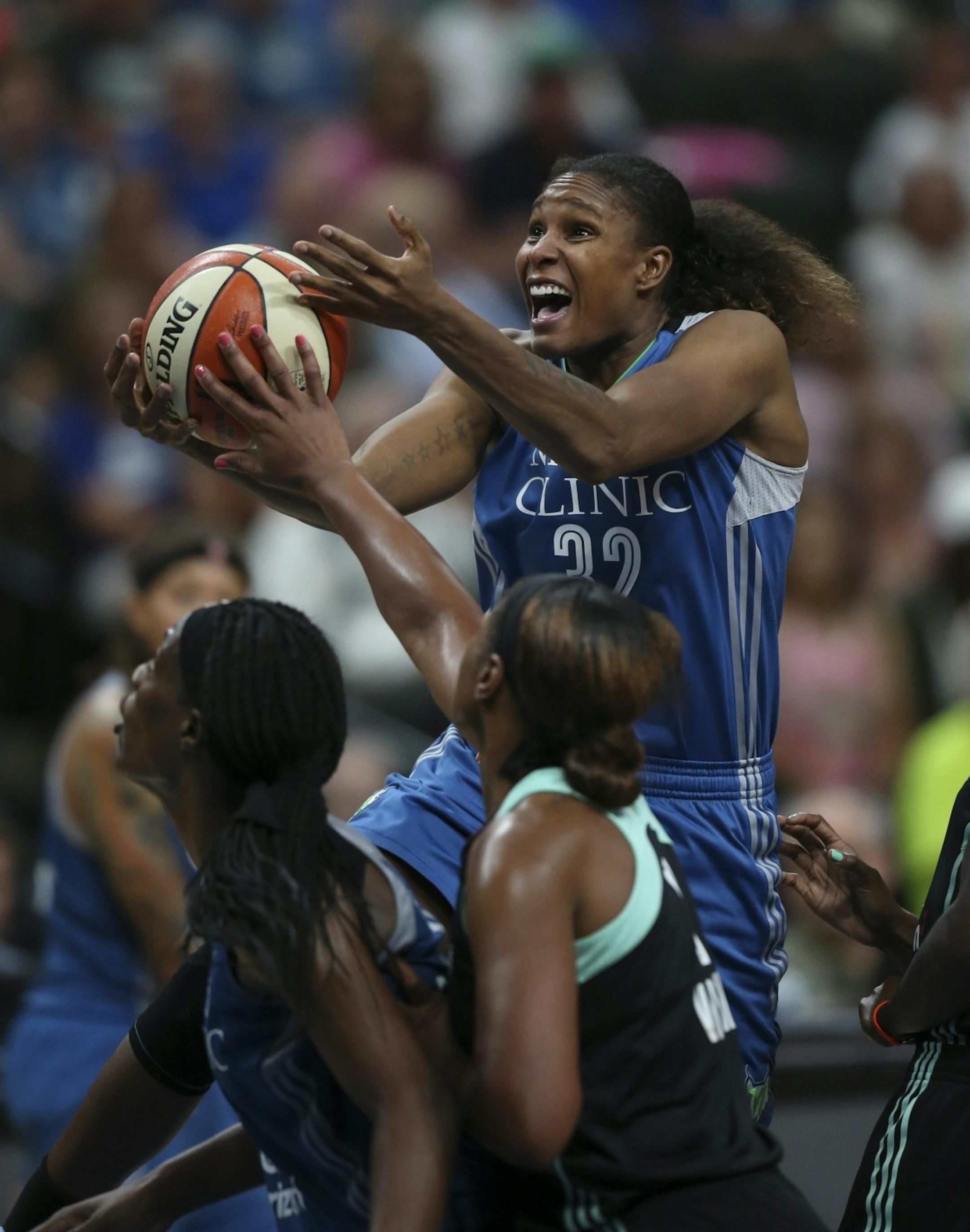 Minnesota Lynx forward Rebekkah Brunson (32) was stripped of the ball while driving for a shot by New York Liberty center Kia Vaughn (7) in the fourth quarter.