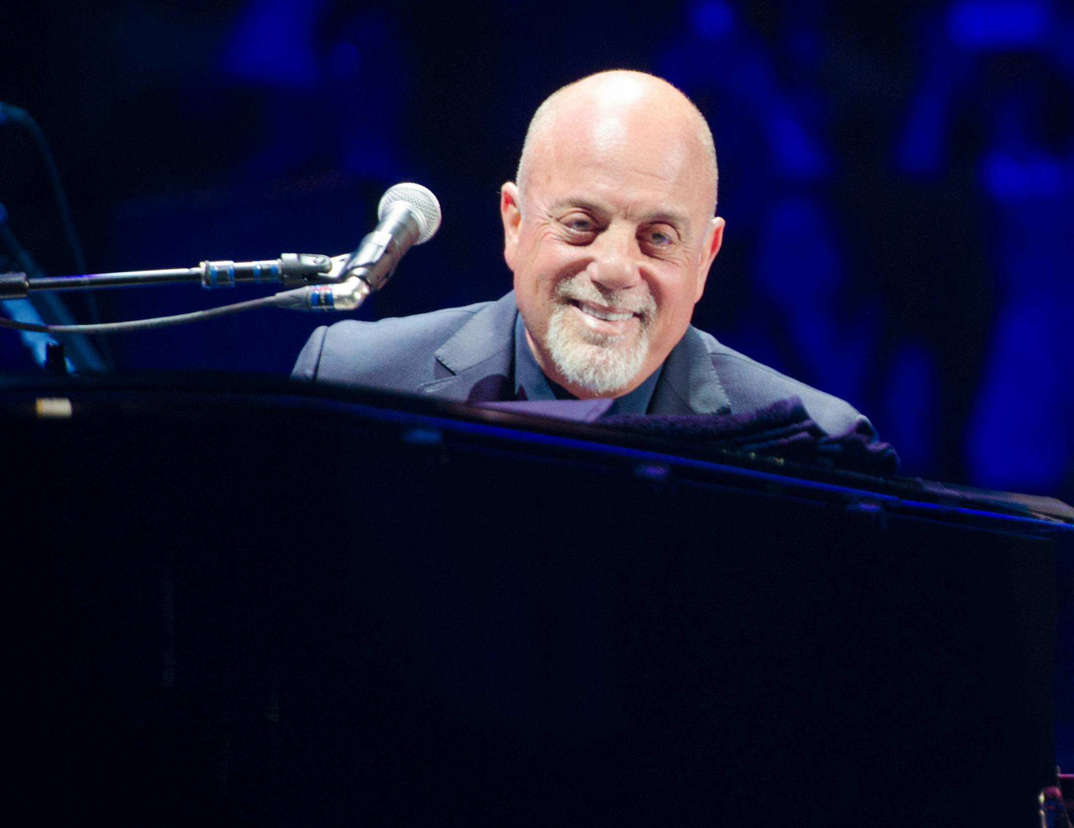 FILE - In this May 9, 2014 file photo, Billy Joel performs at Madison Square Garden in New York. Joel has sold his beachfront mansion on Long Island according to the listing agent, Nancy Mizrahi of Saunders & Associates. Sagaponack is a village in the Town of Southampton in Suffolk County. In 2009, it was listed as the most expensive small village in the U.S.(Photo by Scott Roth/Invision/AP, File) ORG XMIT: NY115