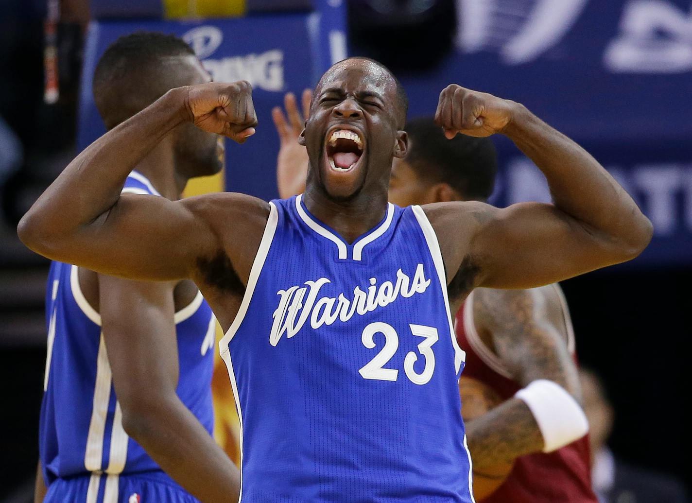 Golden State Warriors' Draymond Green (23) celebrates after scoring against the Cleveland Cavaliers during the first half of an NBA basketball game Friday, Dec. 25, 2015, in Oakland, Calif. (AP Photo/Marcio Jose Sanchez)