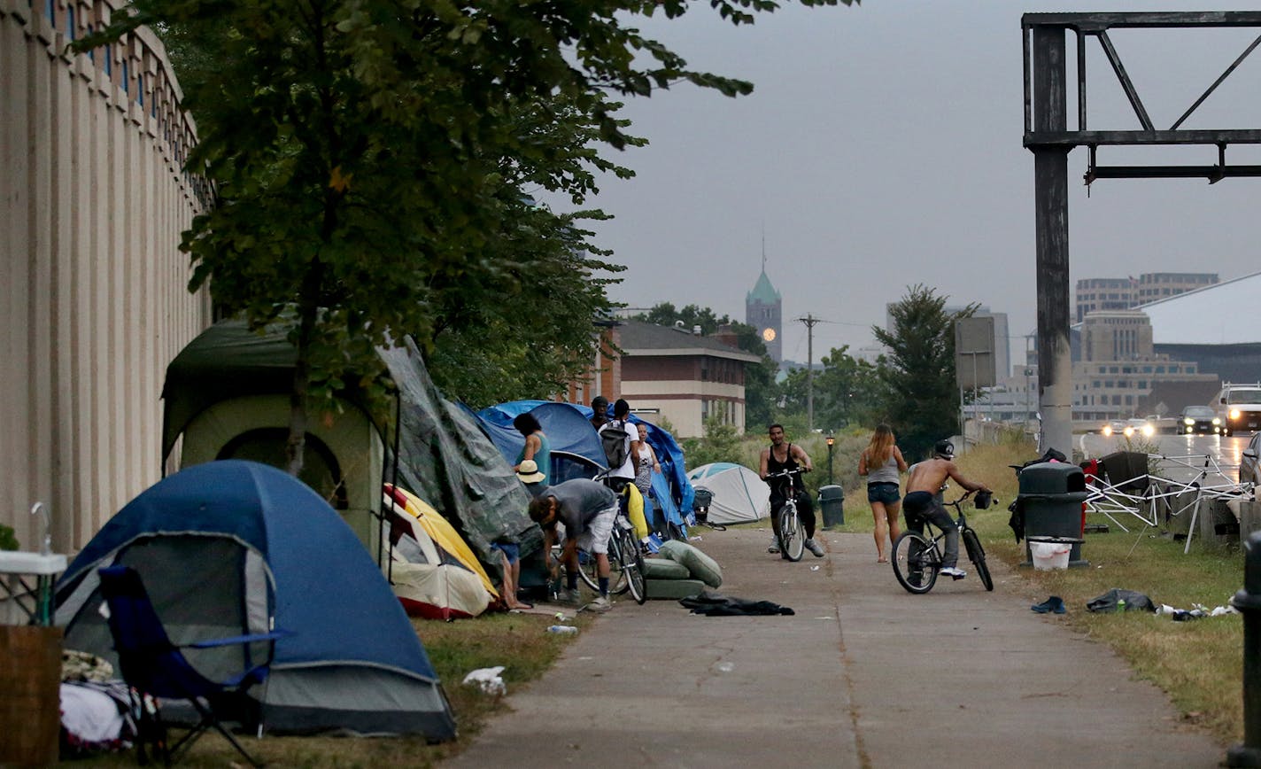 An American Indian encampment in south Minneapolis continues to grow and now includes several families with children. Some have come hoping to receive services that might end their homelessness. Here, the skies darken as a rain storm approaches Monday, Aug. 27, 2018, in Minneapolis, MN.] DAVID JOLES &#xef; david.joles@startribune.com Homeless families at the American Indian encampment in south Minneapolis**Koda Deer,cq