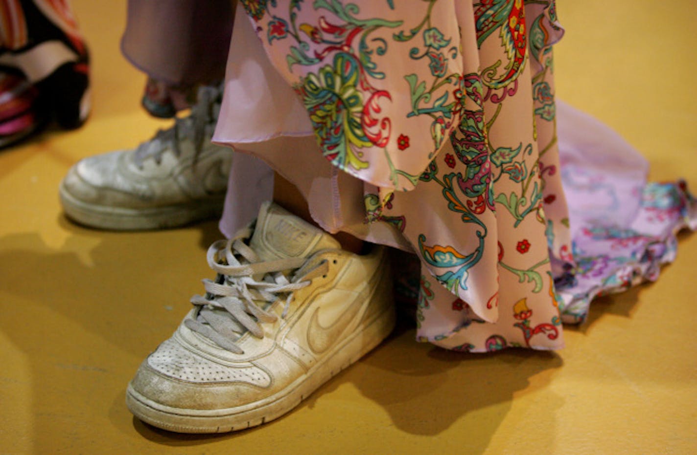 Litchfield junior Kalli Swanson exchanged her dress shoes for tennis shoes after the prom dance.